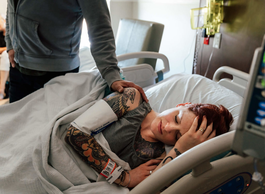 mother resting after epidural in the hospital before her baby arrives