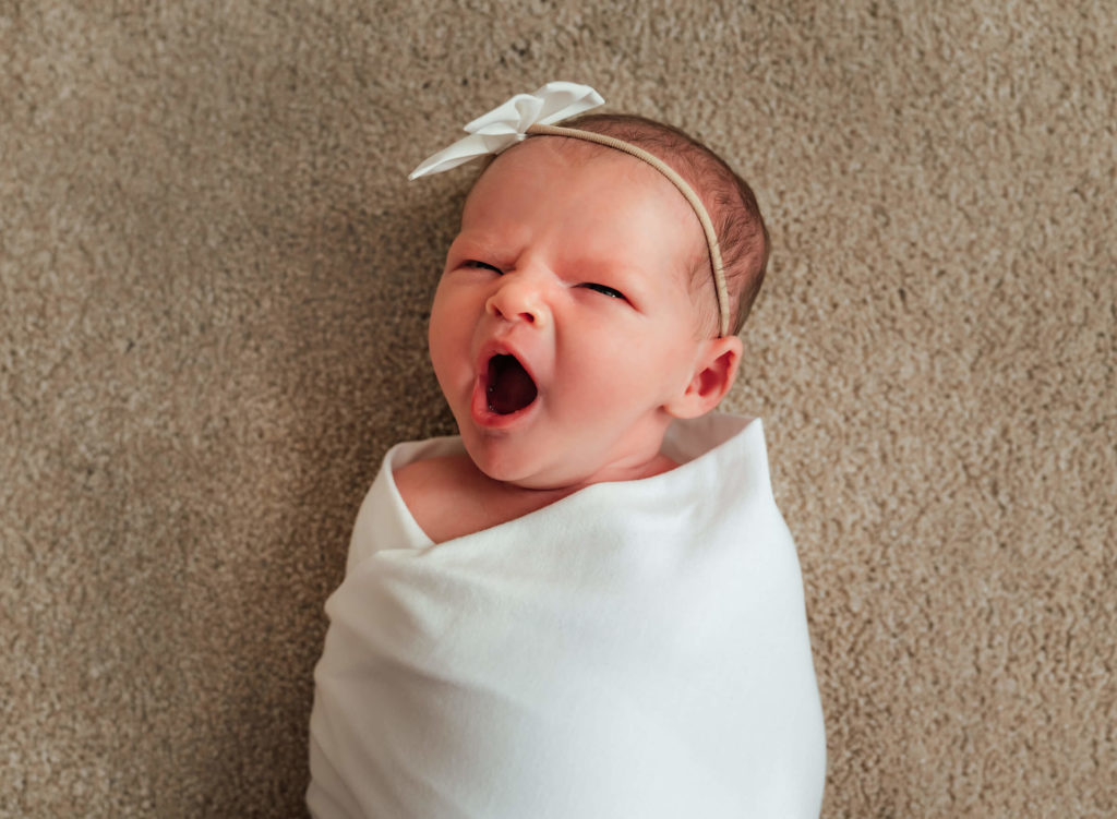 cute newborn yawn during lifestyle newborn session in Las Vegas
