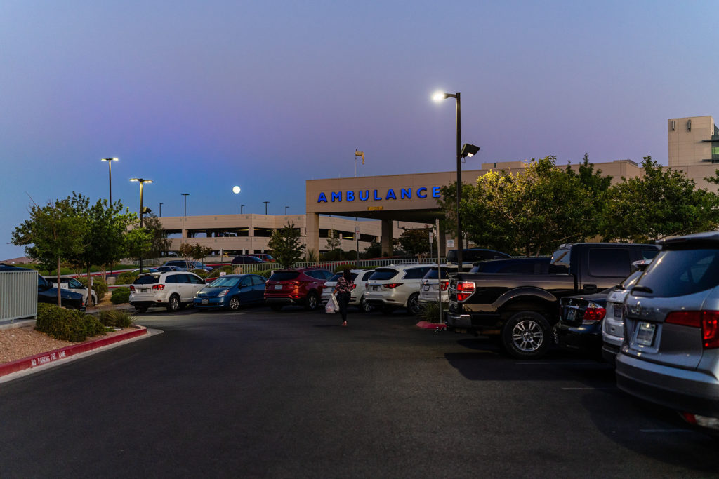 summerlin hospital at night with a full moon. 