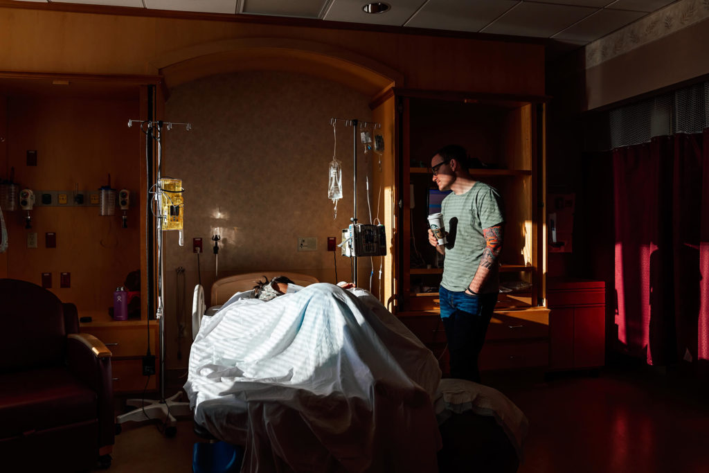 documentary style image of mother laboring with the support of her husband in St Rose San Martin hospital in Las Vegas