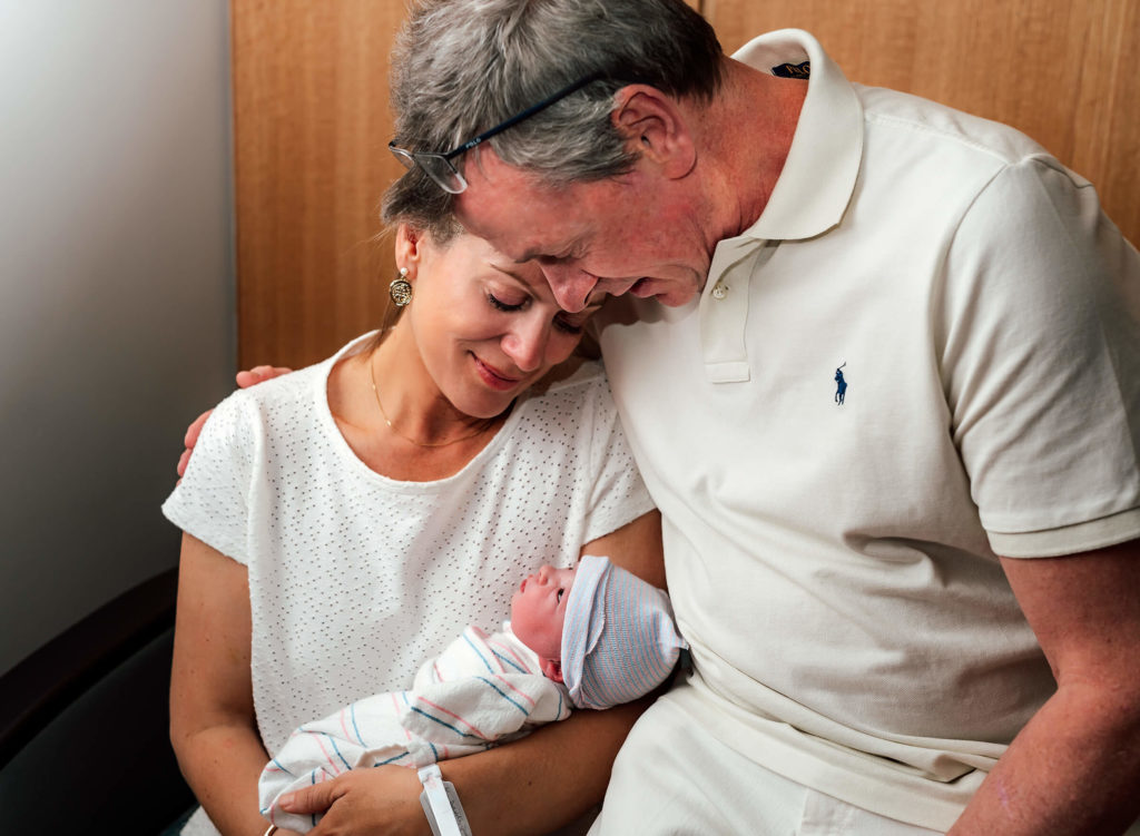 parents surrogacy holding new baby for the first time at Centennial Hills hospital in Las Vegas, NV