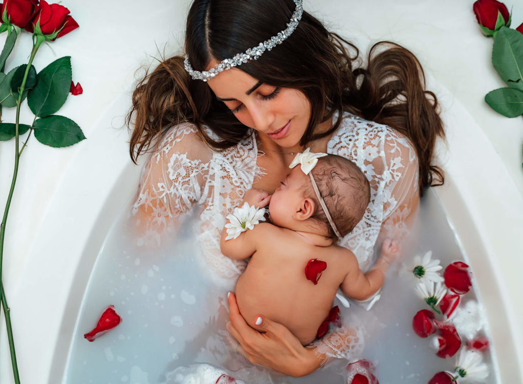 newborn session using milk bath and flowers in Las Vegas after baby released from NICU