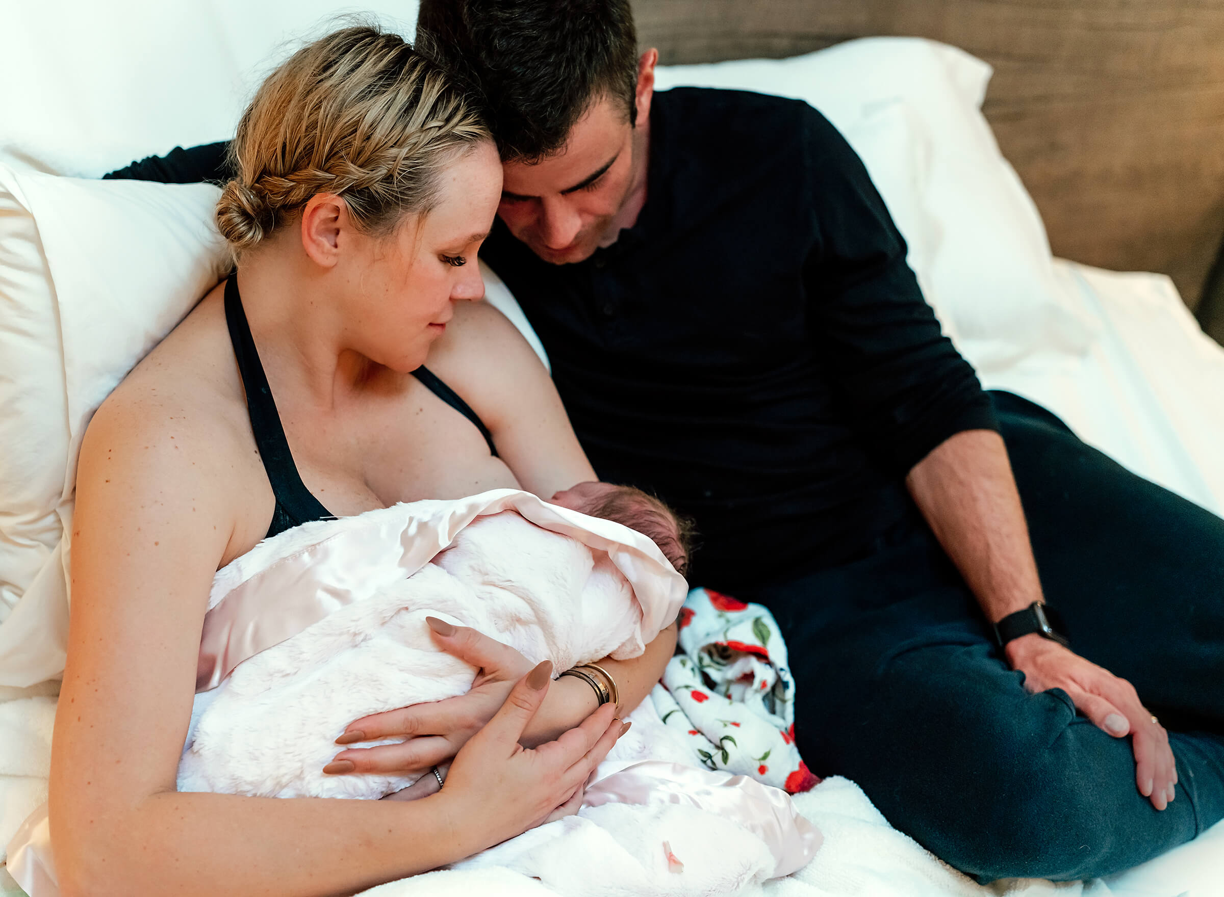 husband and wife with new baby at home after home birth in Las Vegas