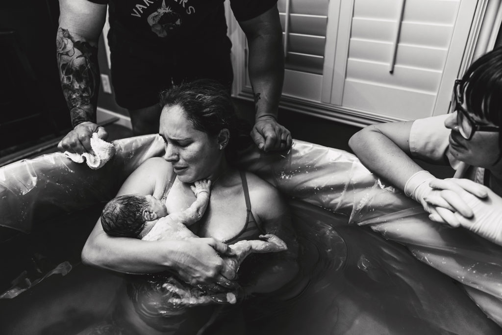 family surrounding a mother after her home birth in Las Vegas
