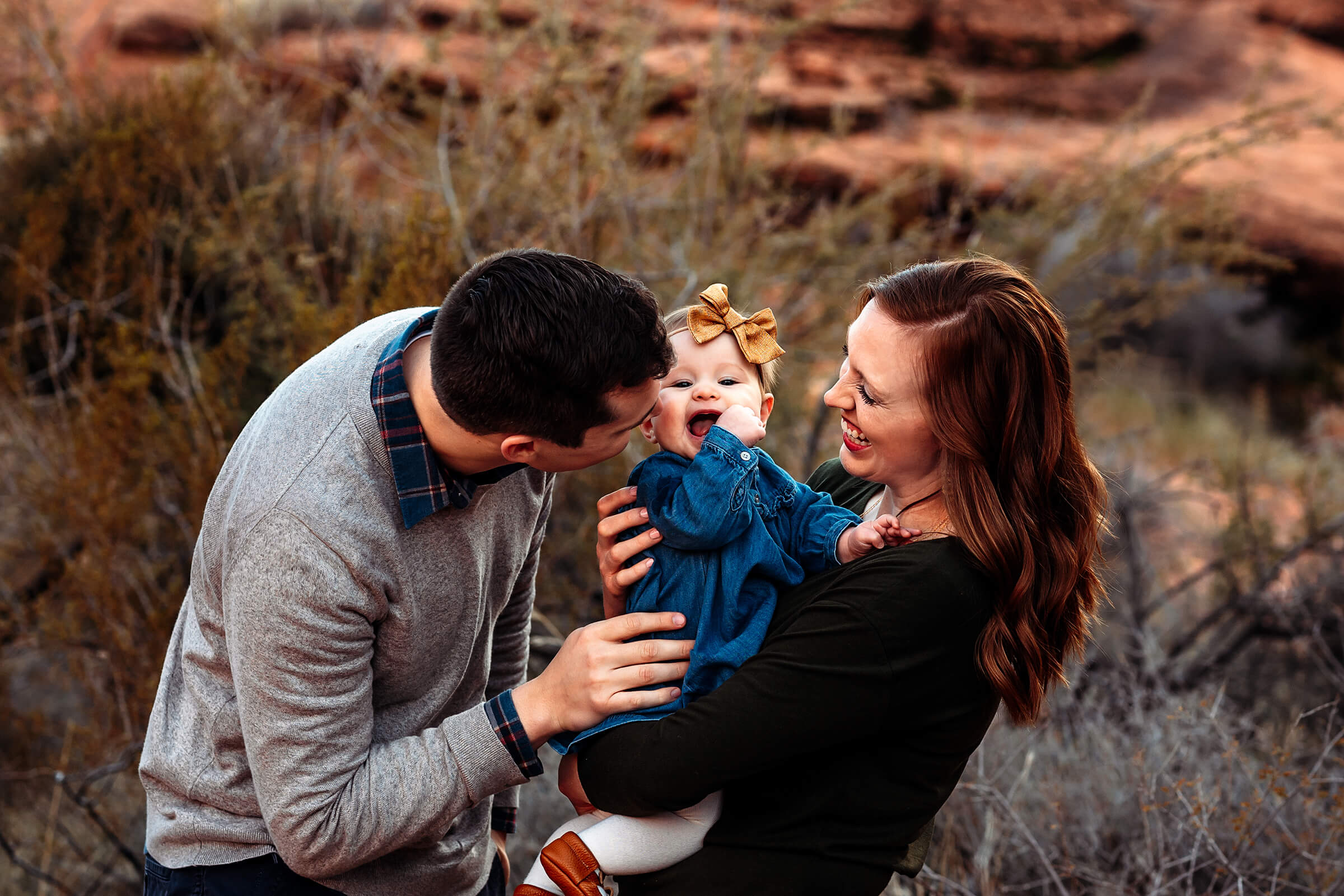 small family of three interacting with each other during their family session at Valley of Fire state park