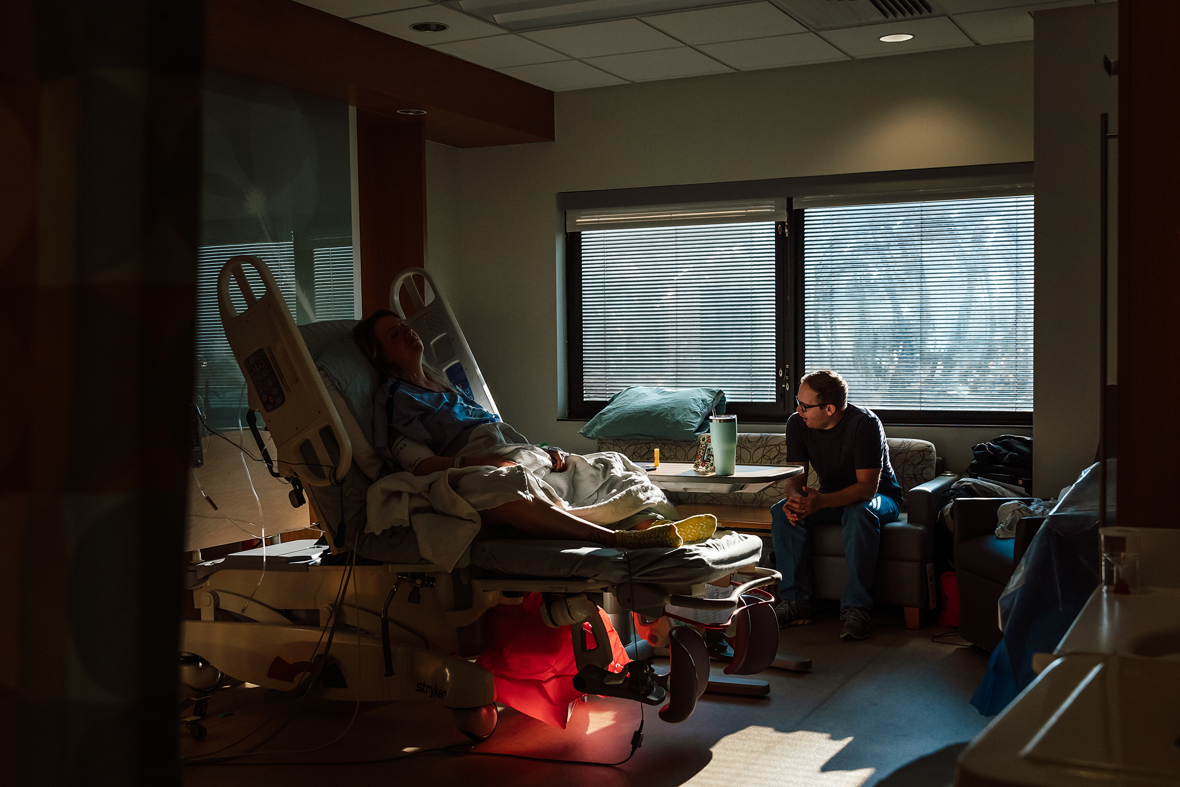 father at the bedside during the long process of labor induction 