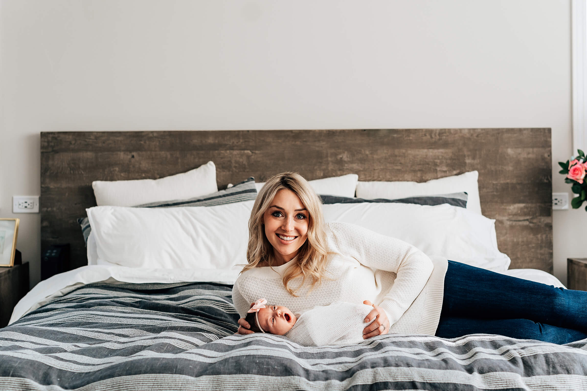 using the parents bedroom during a lifestyle newborn session 
