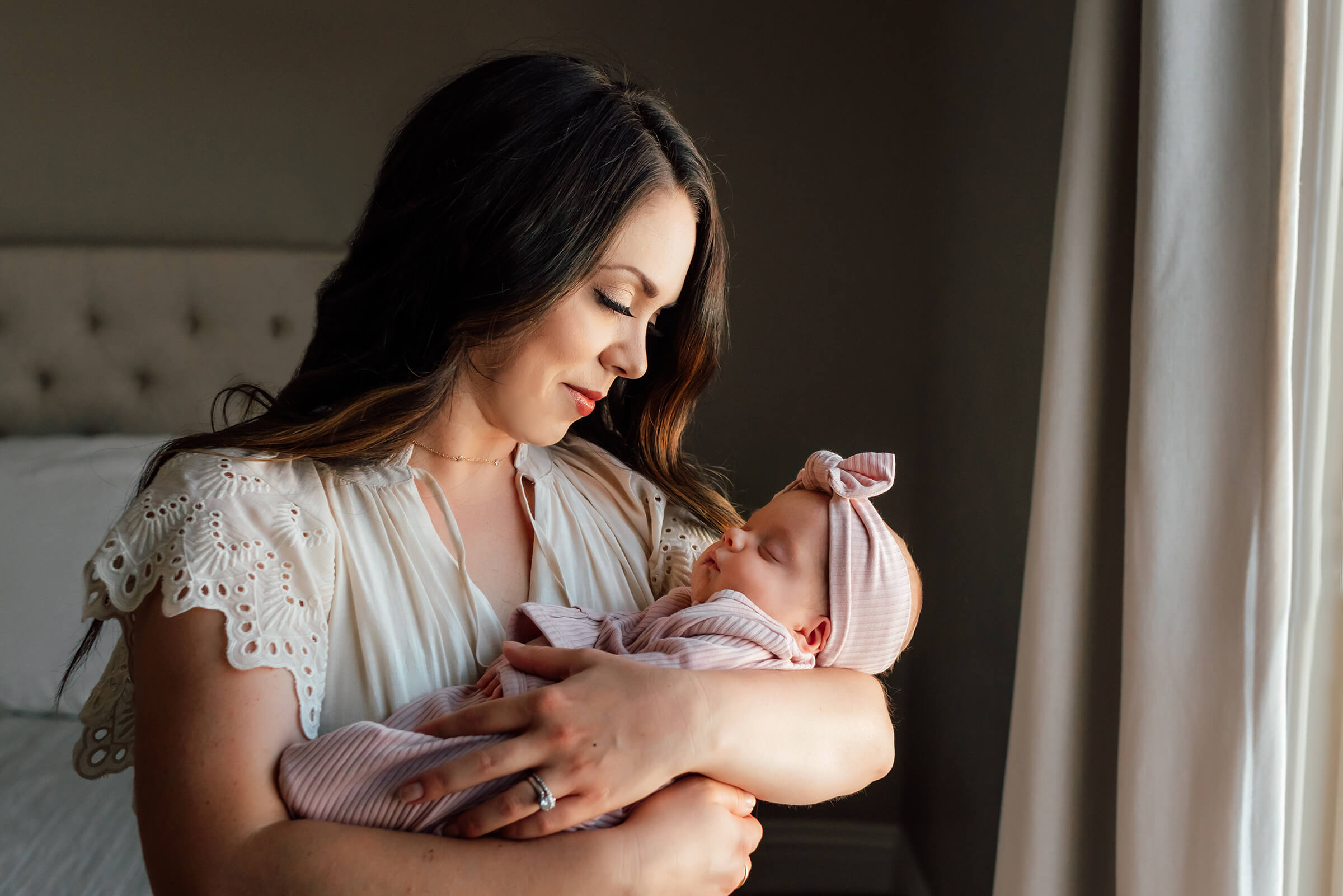 mom and baby at home during newborn session 