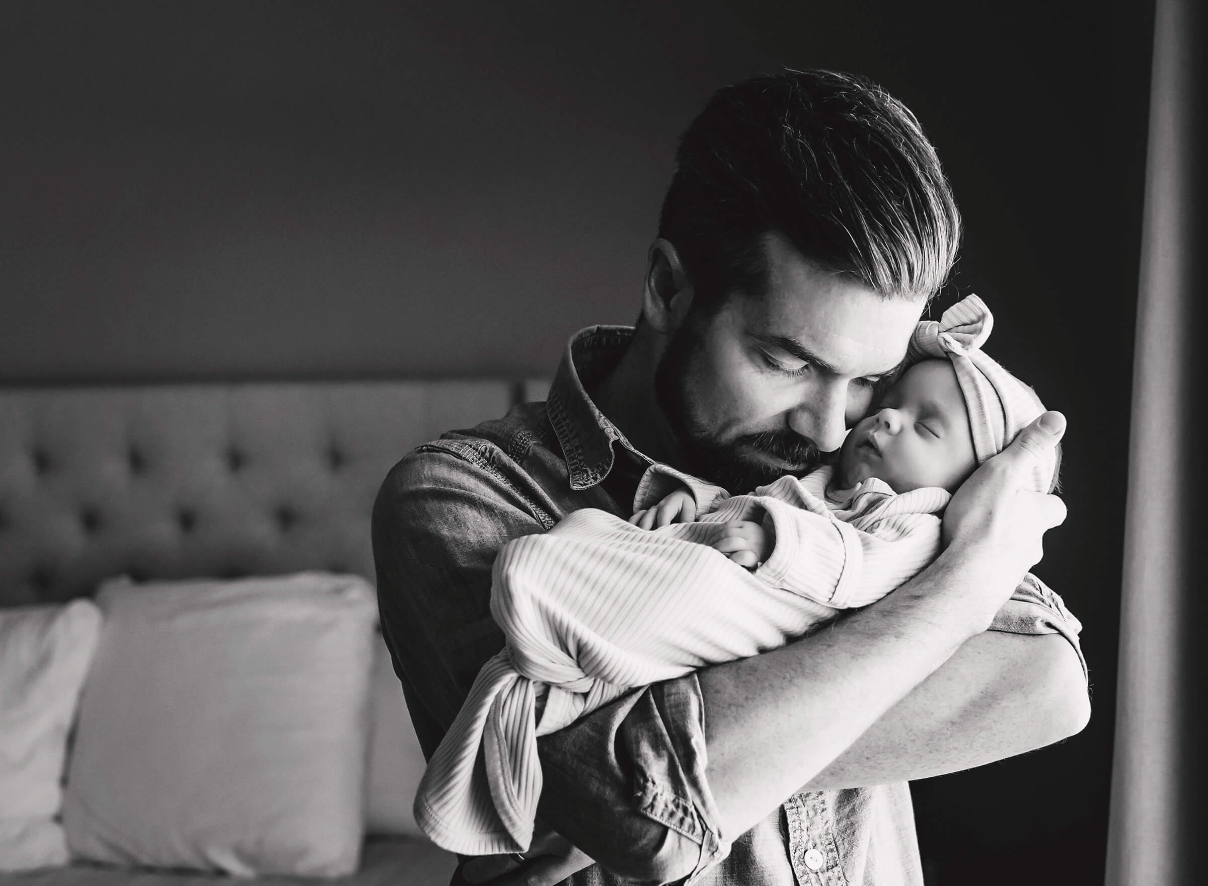 beautiful black and white image of dad and baby
