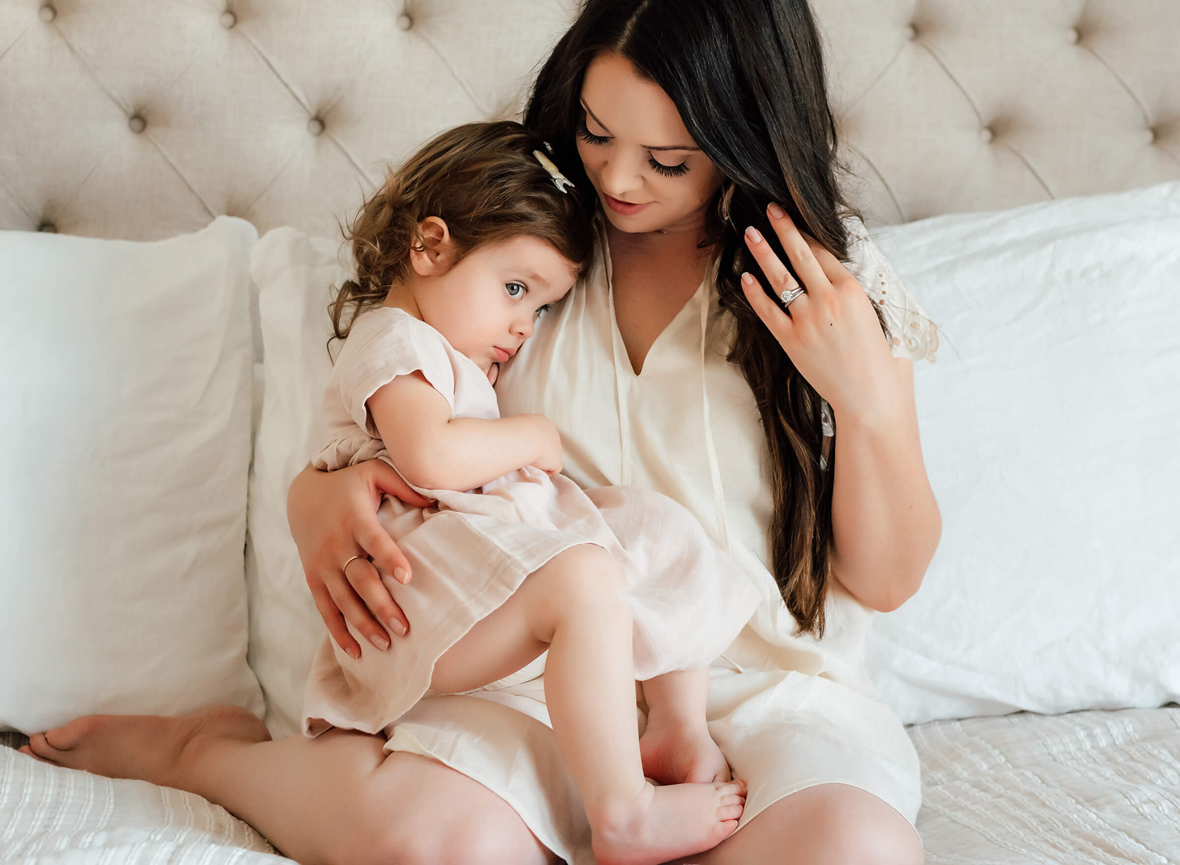 big sister with her mom during their newborn session 