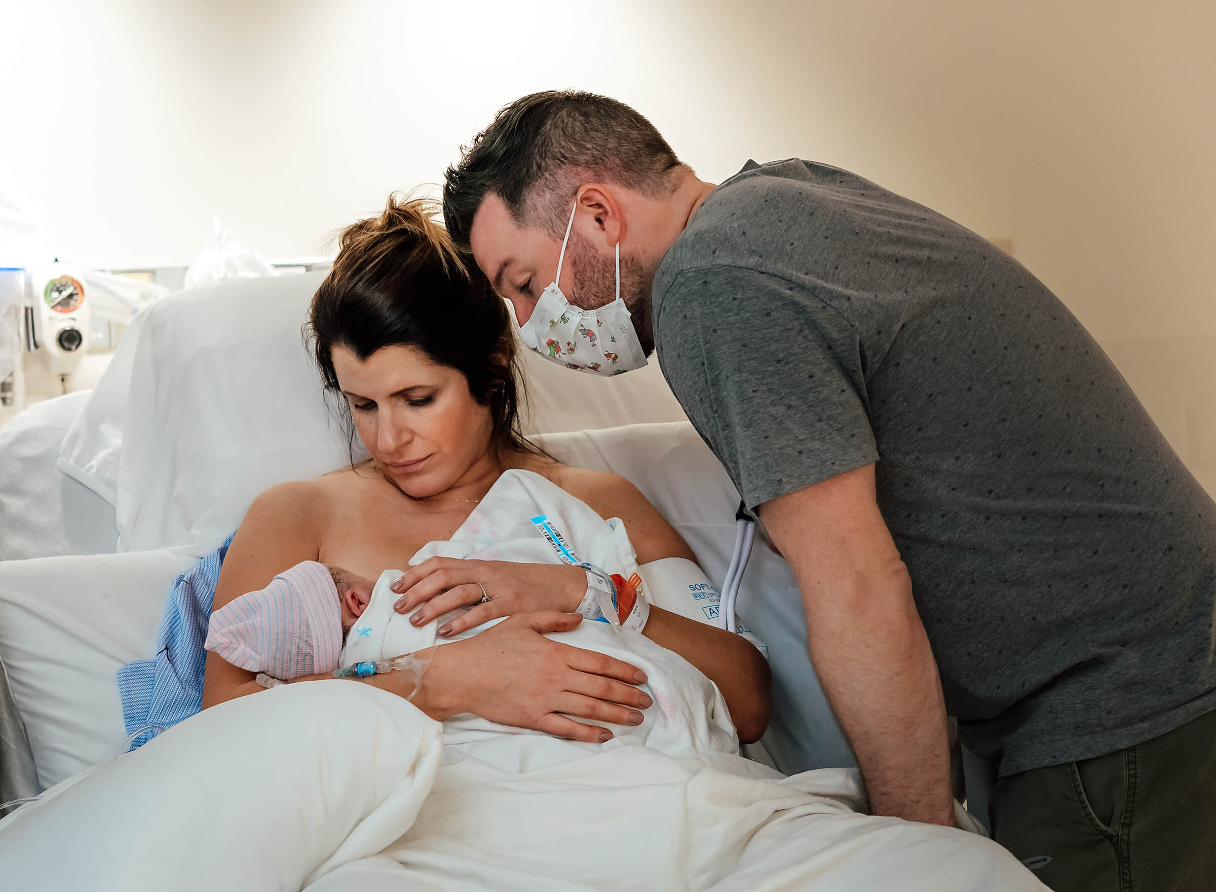 parents meeting their baby for the first time after delivery