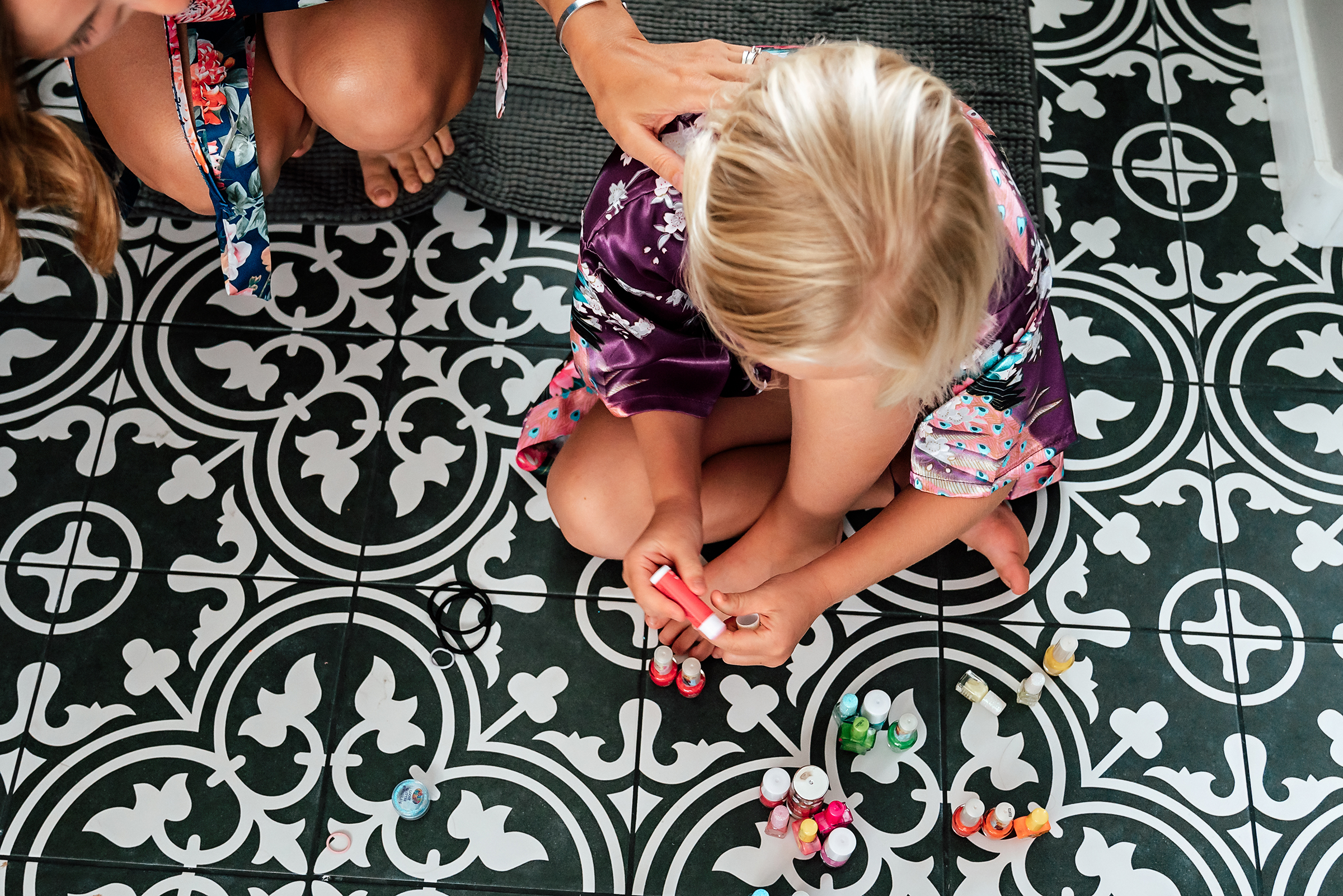 painting toe nails during family session 