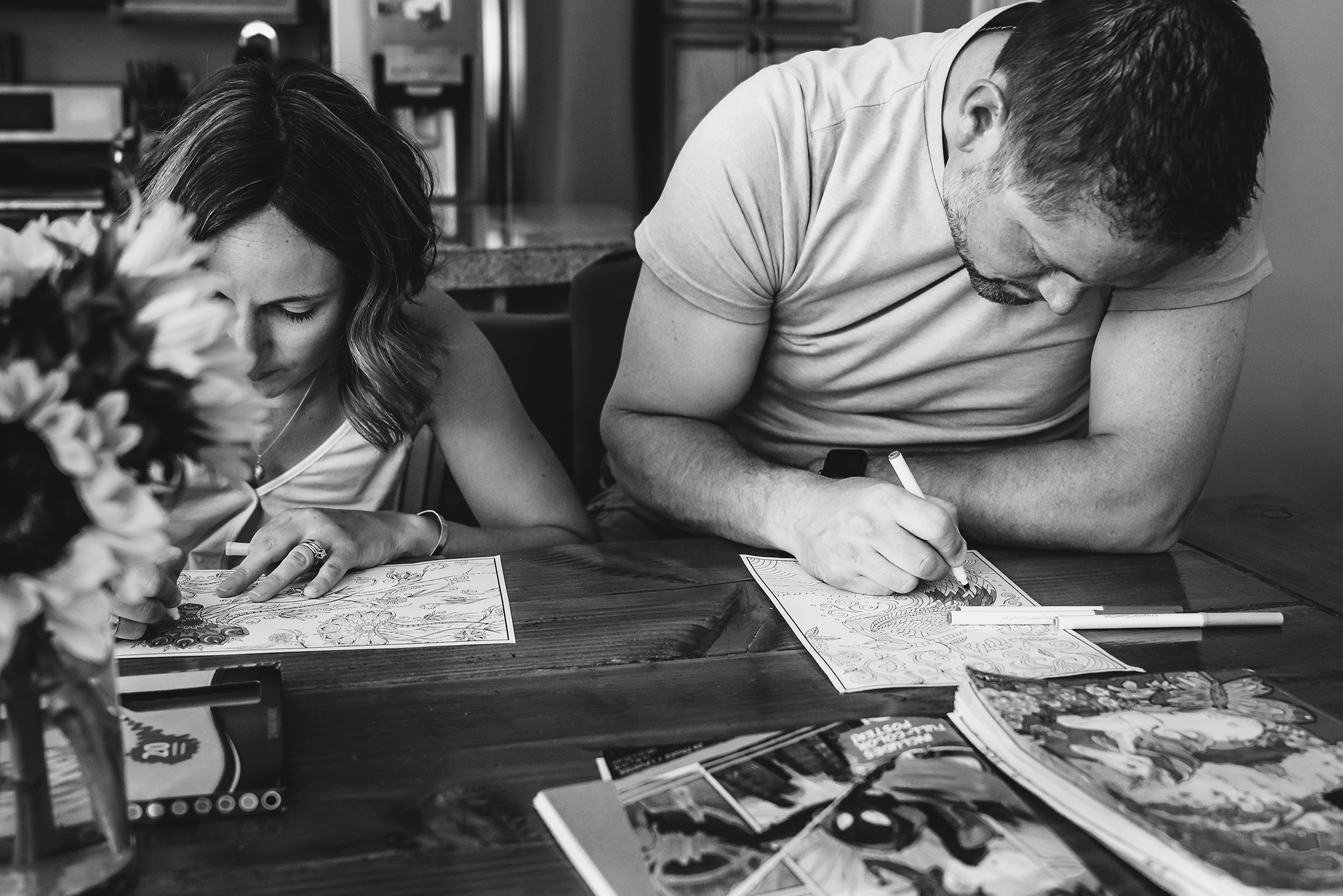 mom and dad coloring with their children as an activity