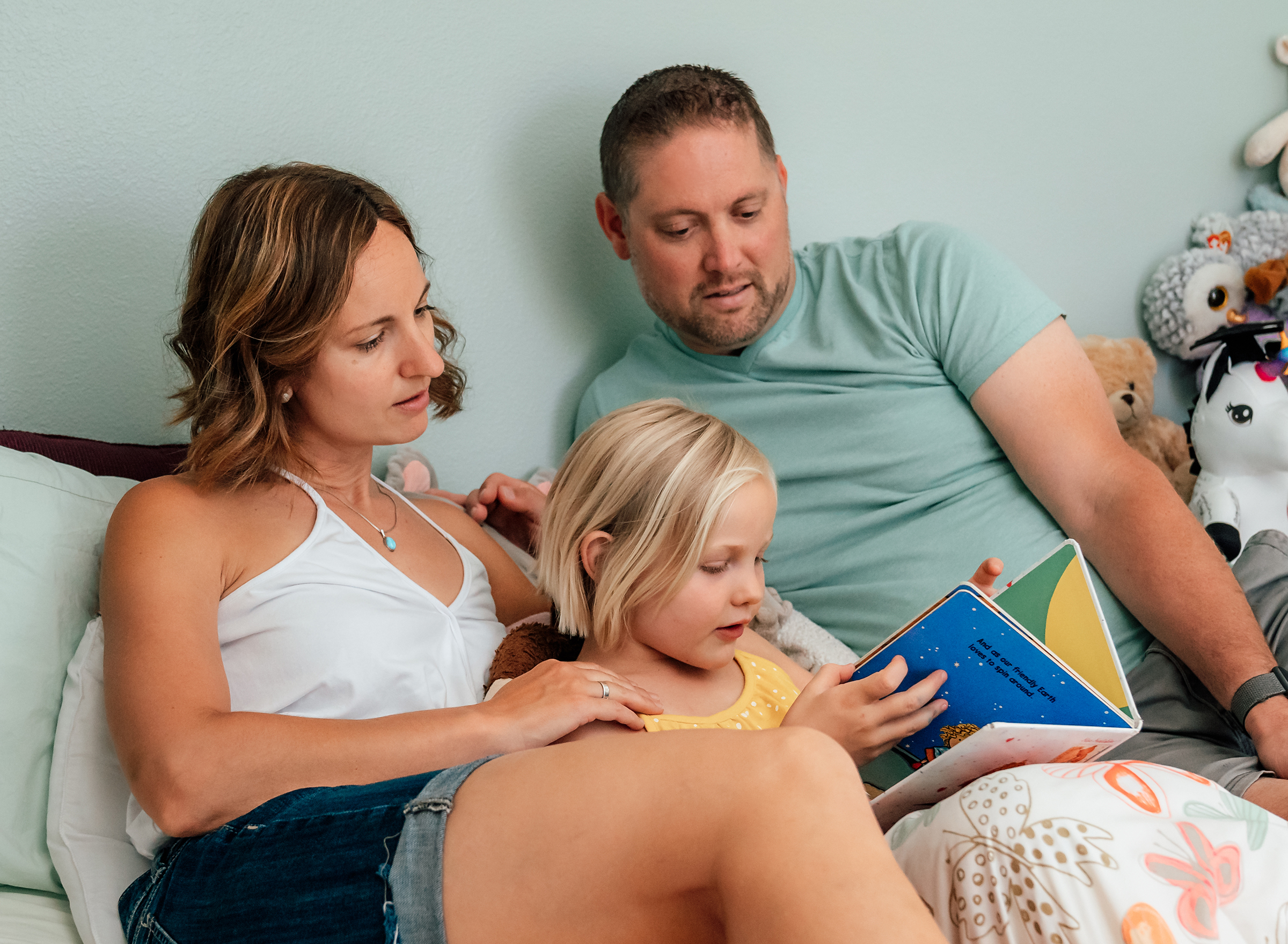 daughter reading to her parents at home