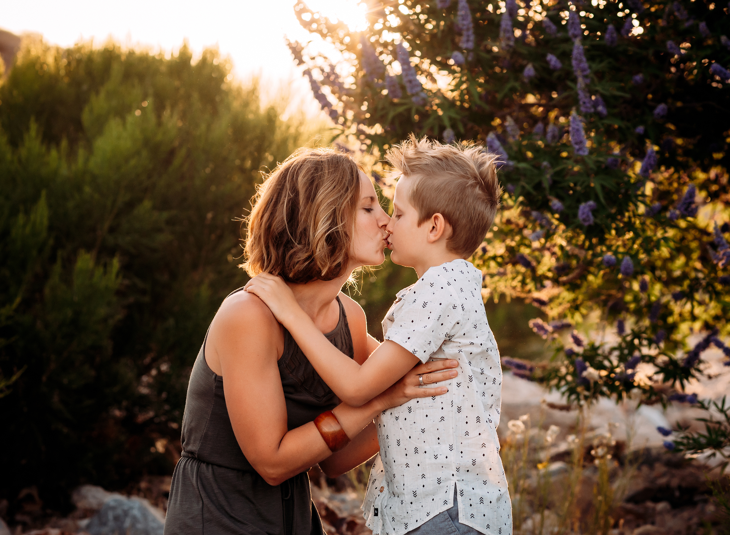 mom and son poses during family session 