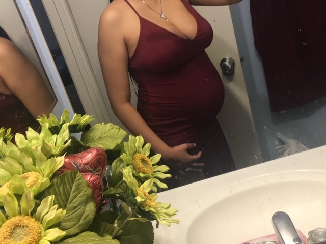 pregnant belly in mirror at 6 months