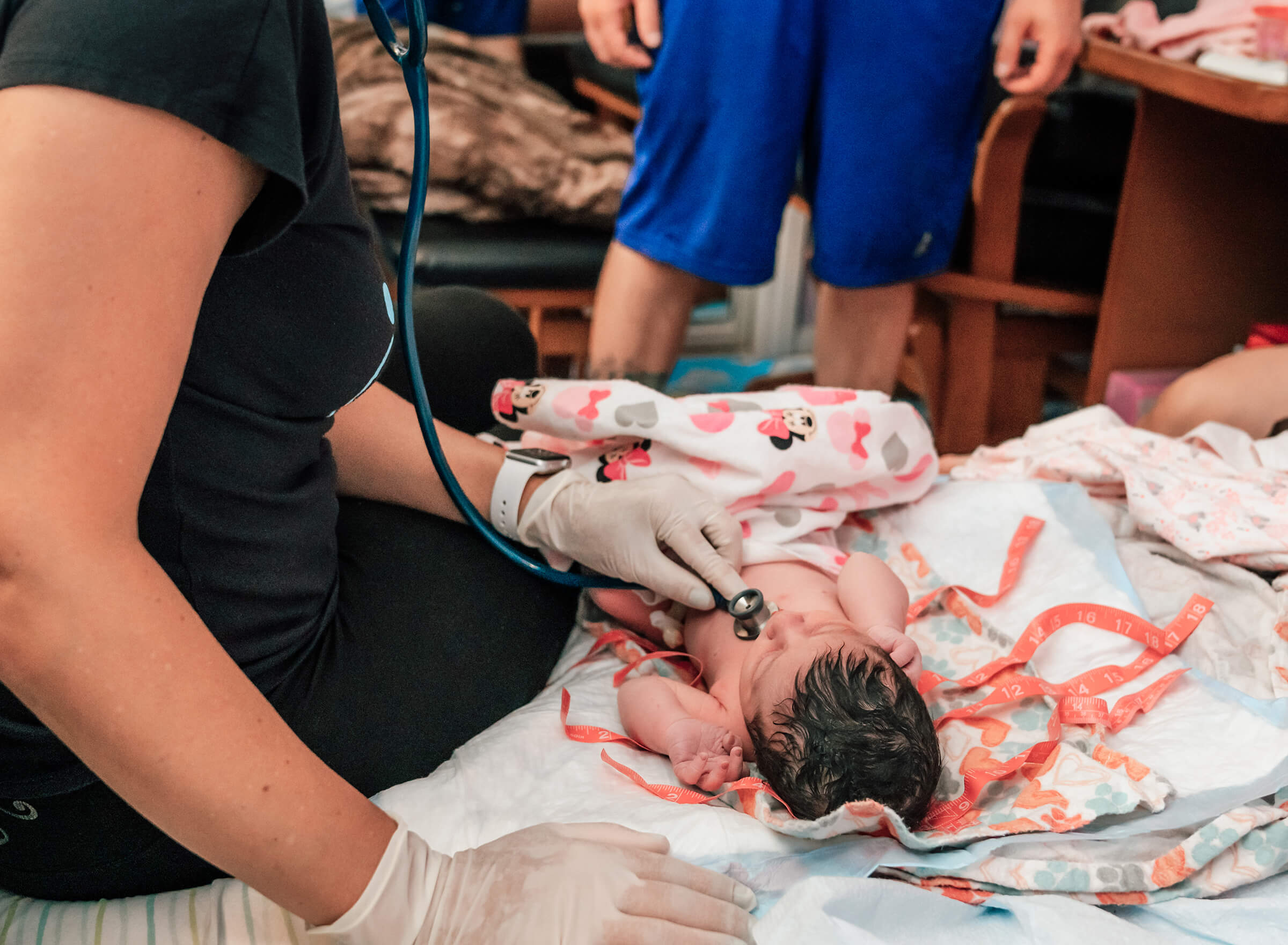 Las Vegas midwife performing newborn exam