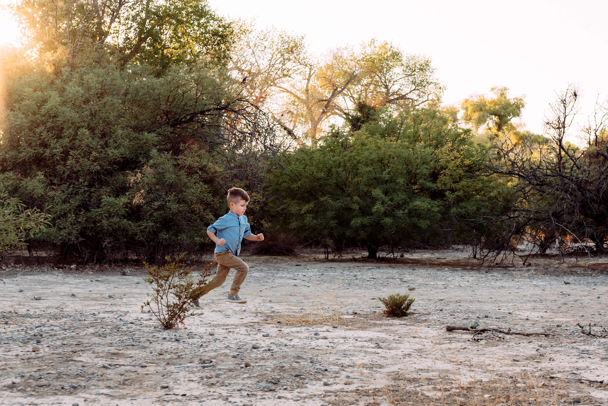 boy running as fast as he can during family session