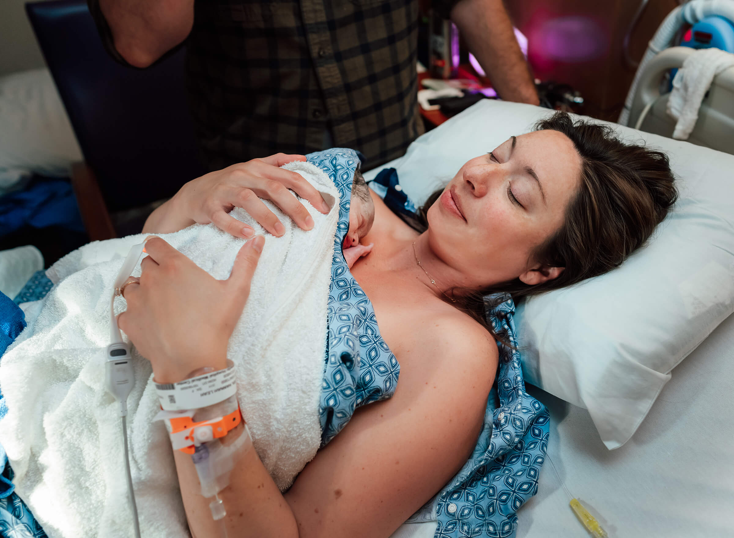 tender moment between mom and baby after vaginal delivery
