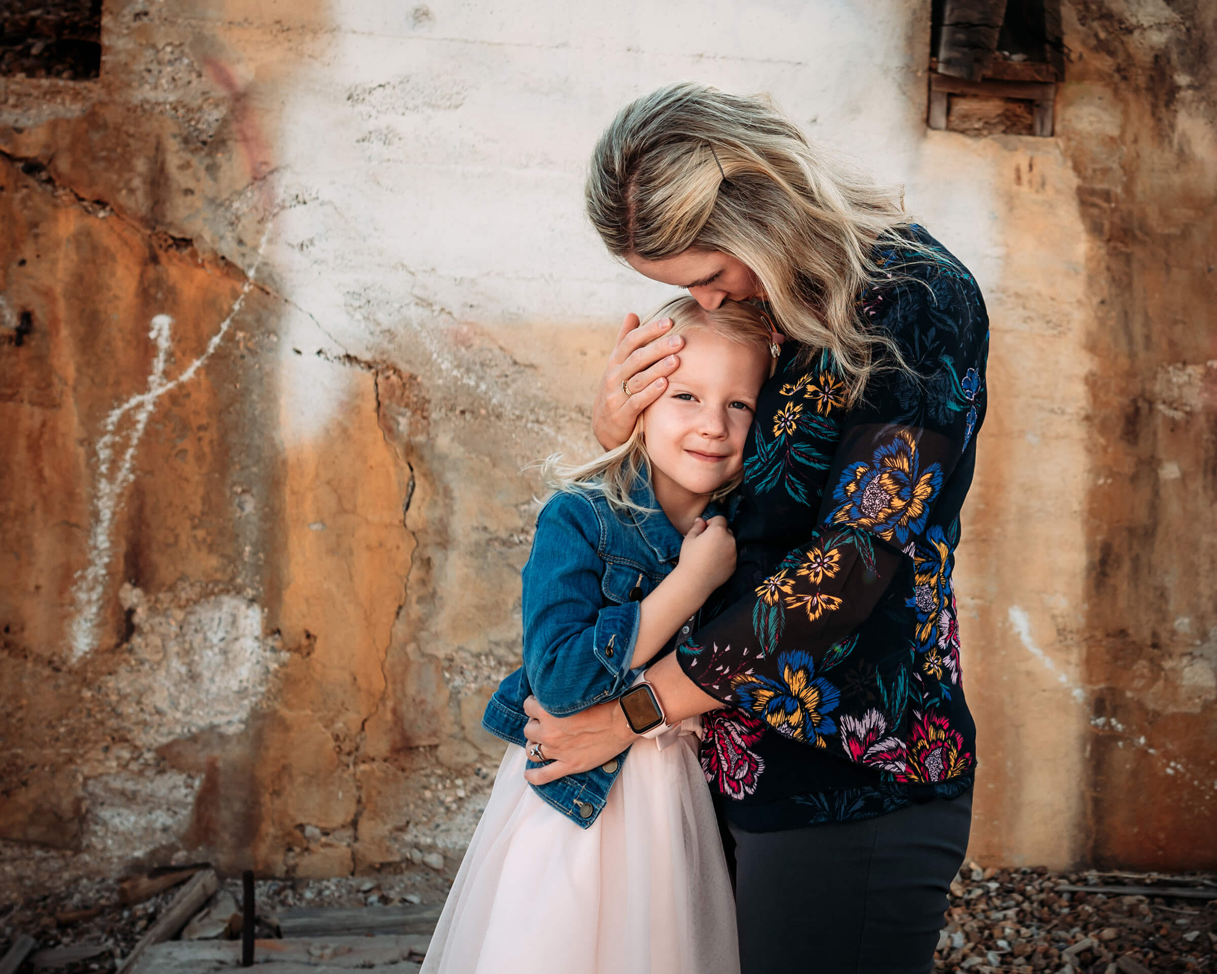 mom holding her daughter tight and tenderly during a Las Vegas family session 