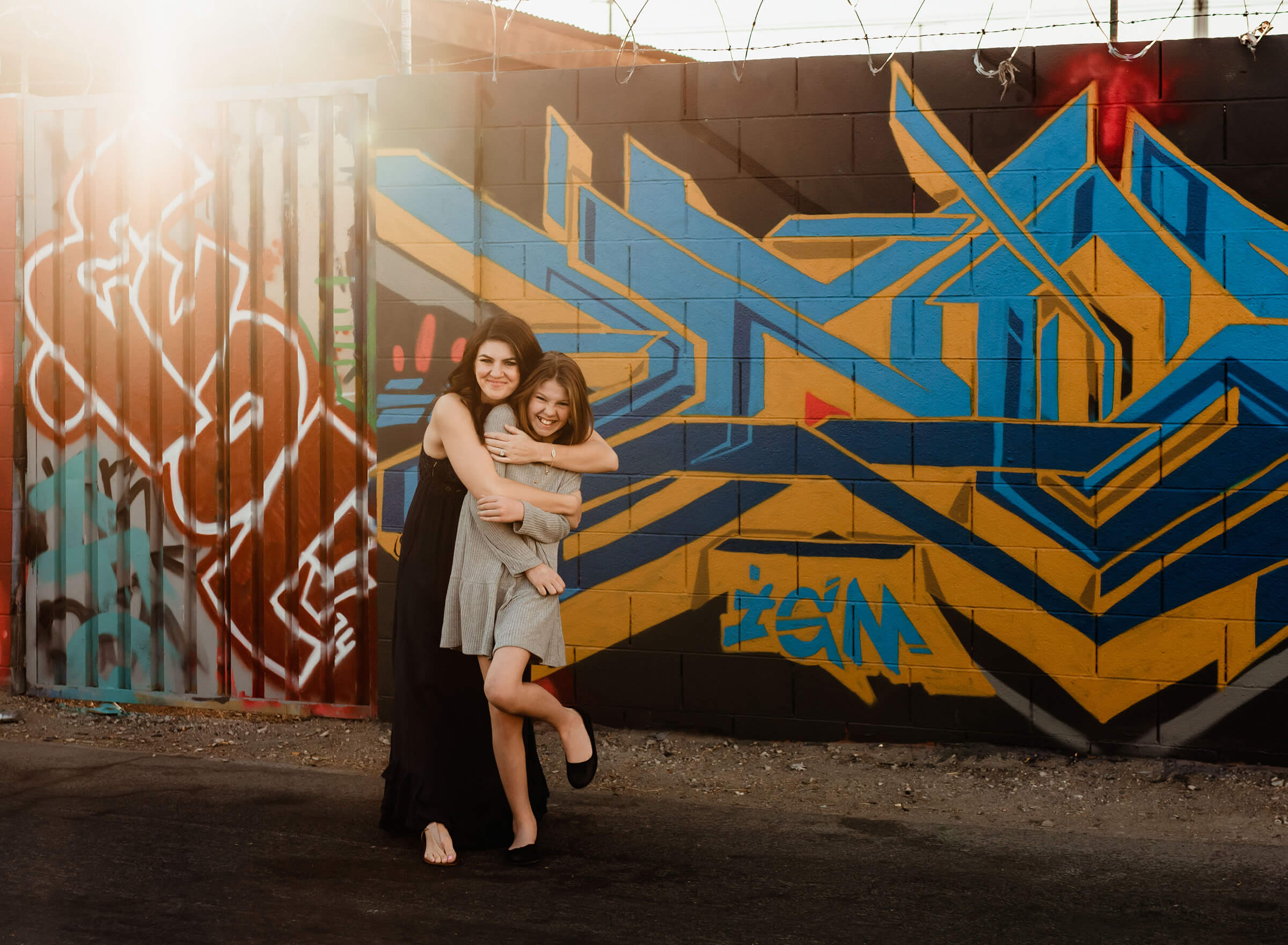 mom hugging her daughter during an urban family session 