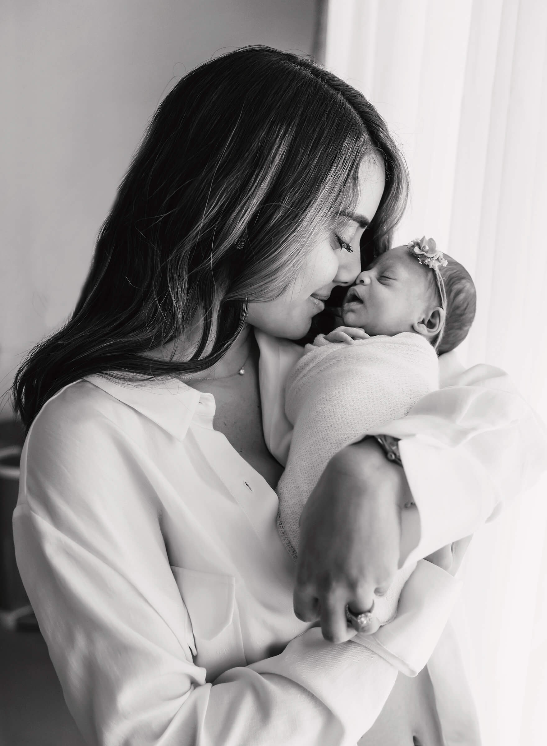 beautiful black and white image of mother and newborn 