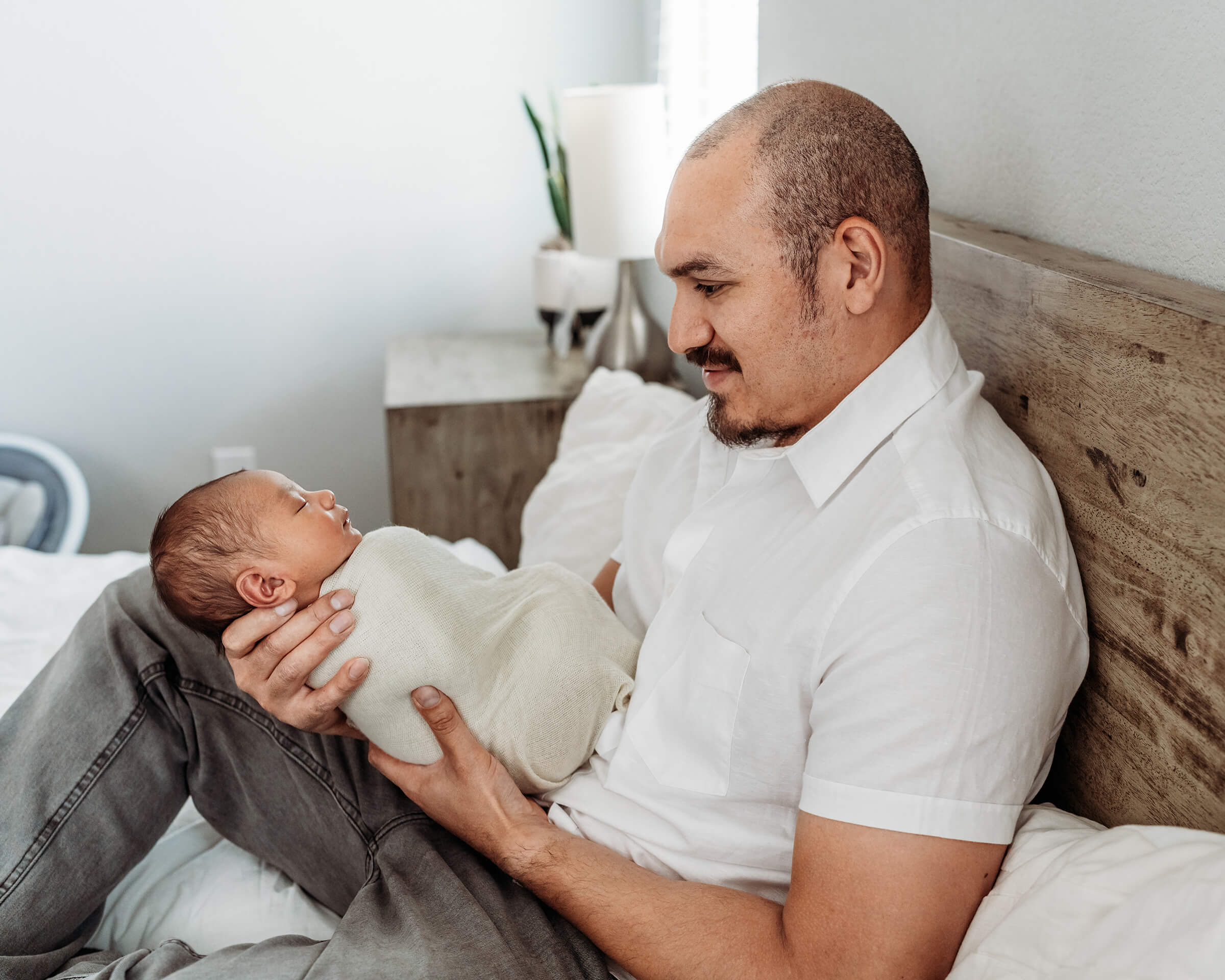 father holding his son newborn session 