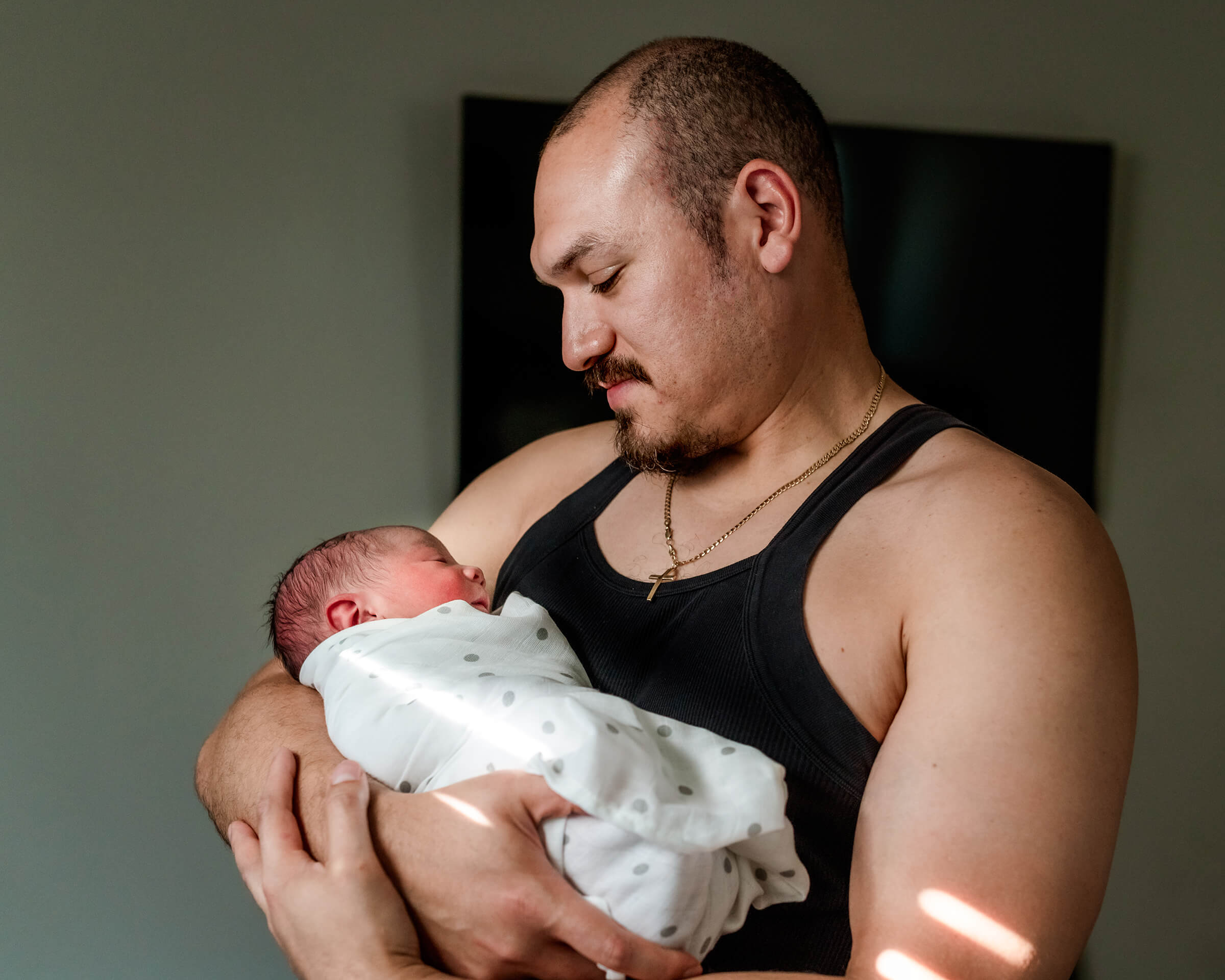 father and son at home after beautiful home birth 
