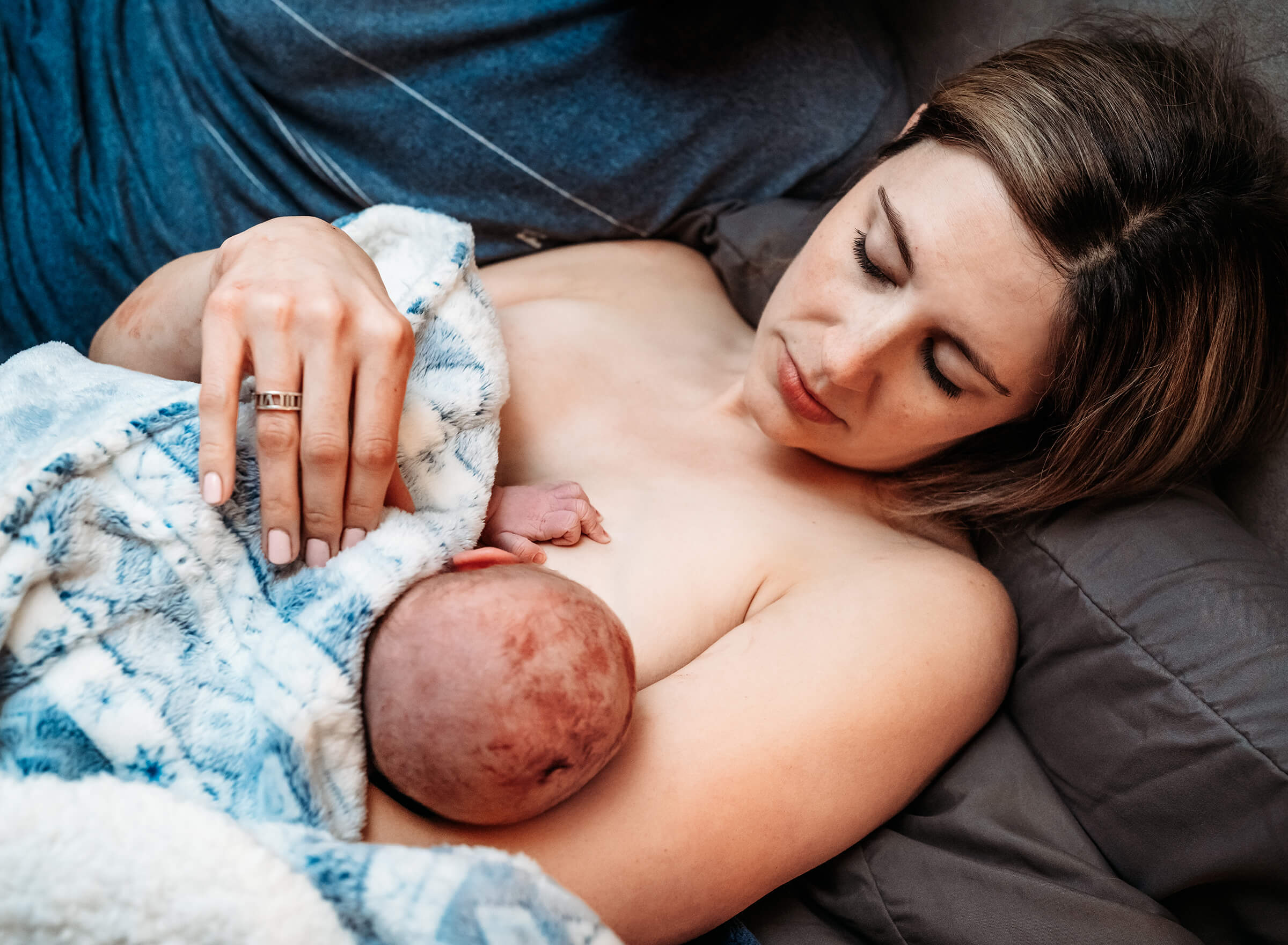 mother holding her son after delivery at home