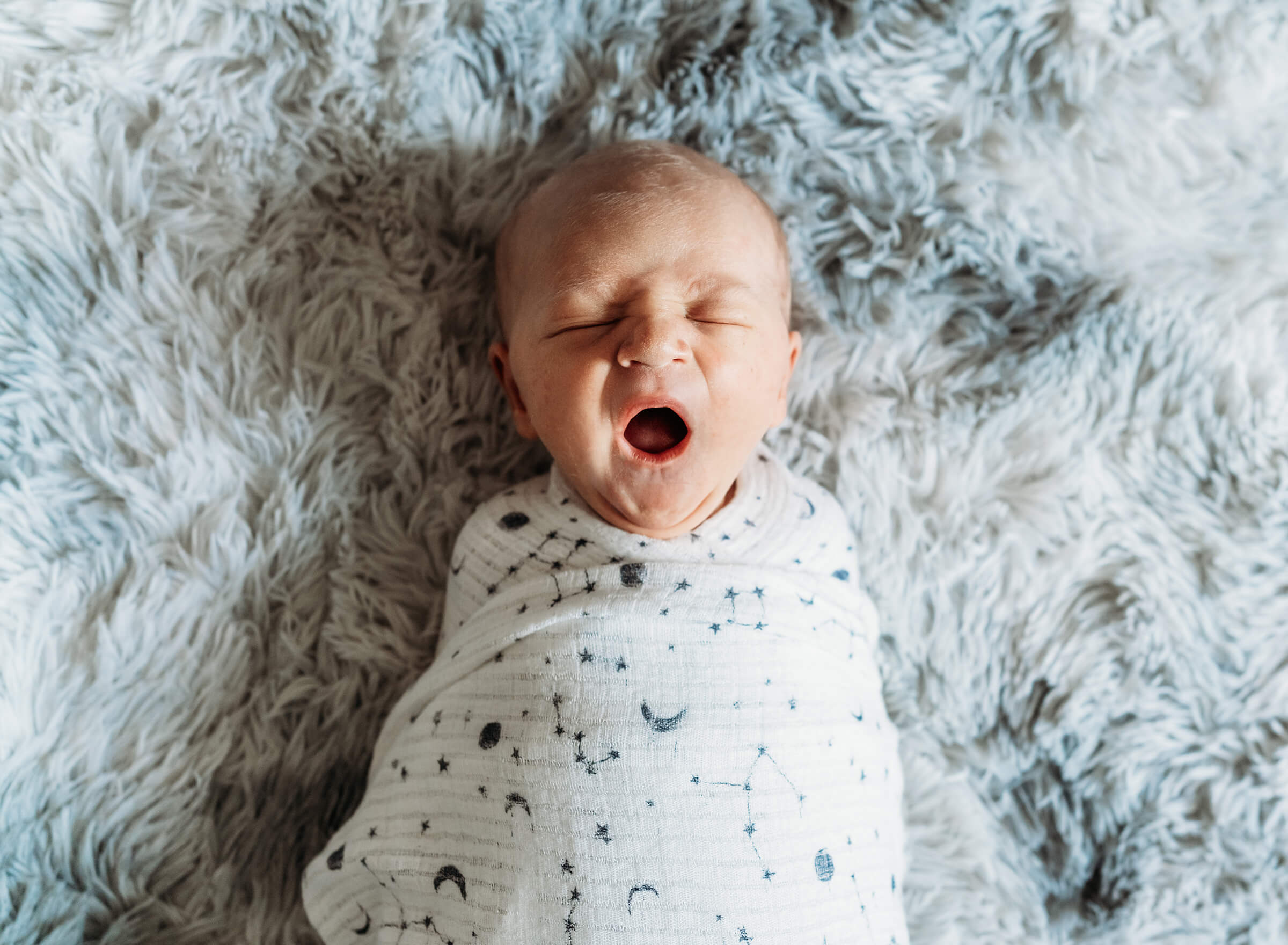 sweet newborn yawn in home session