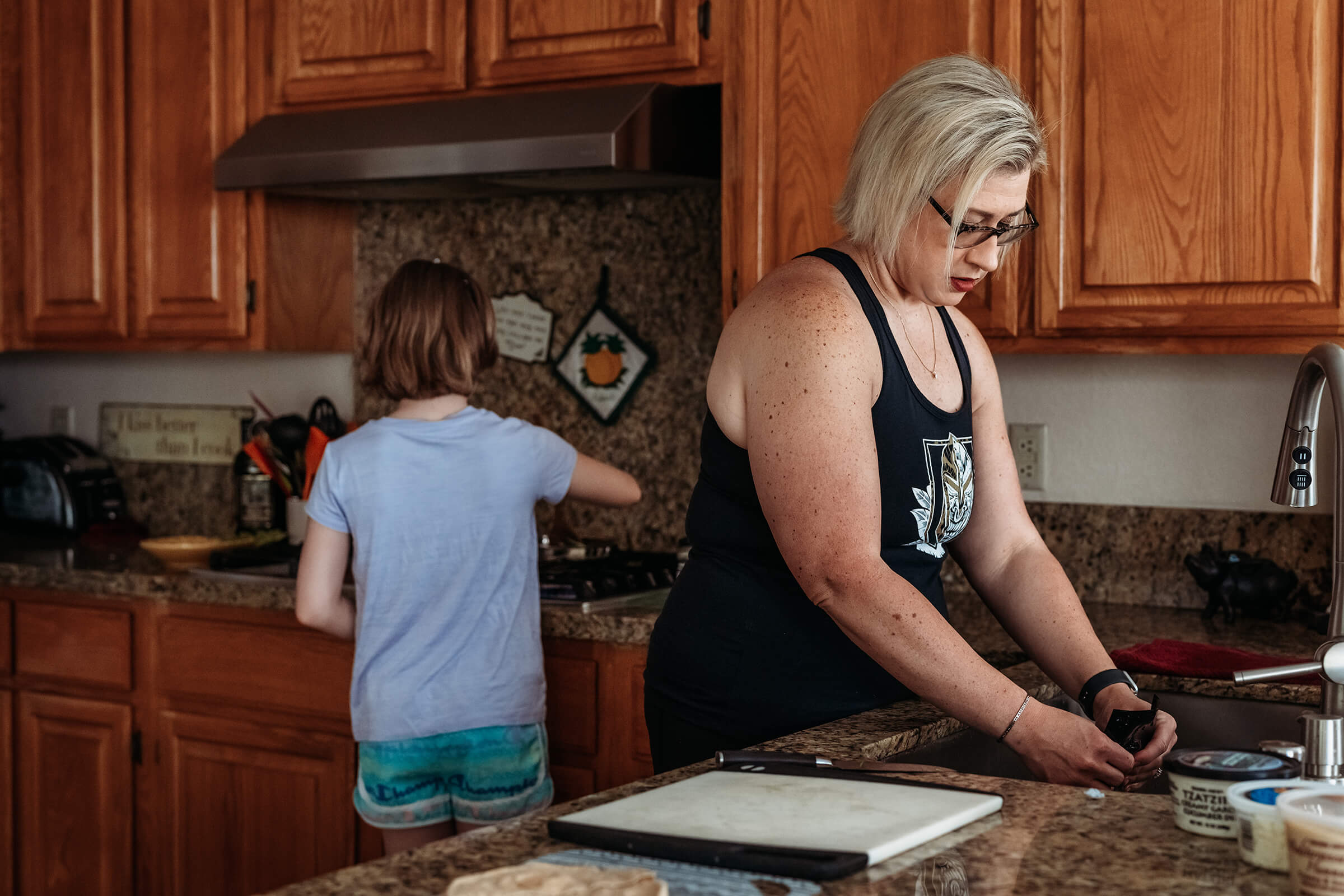 Ashley cooking dinner with her daughter in Henderson