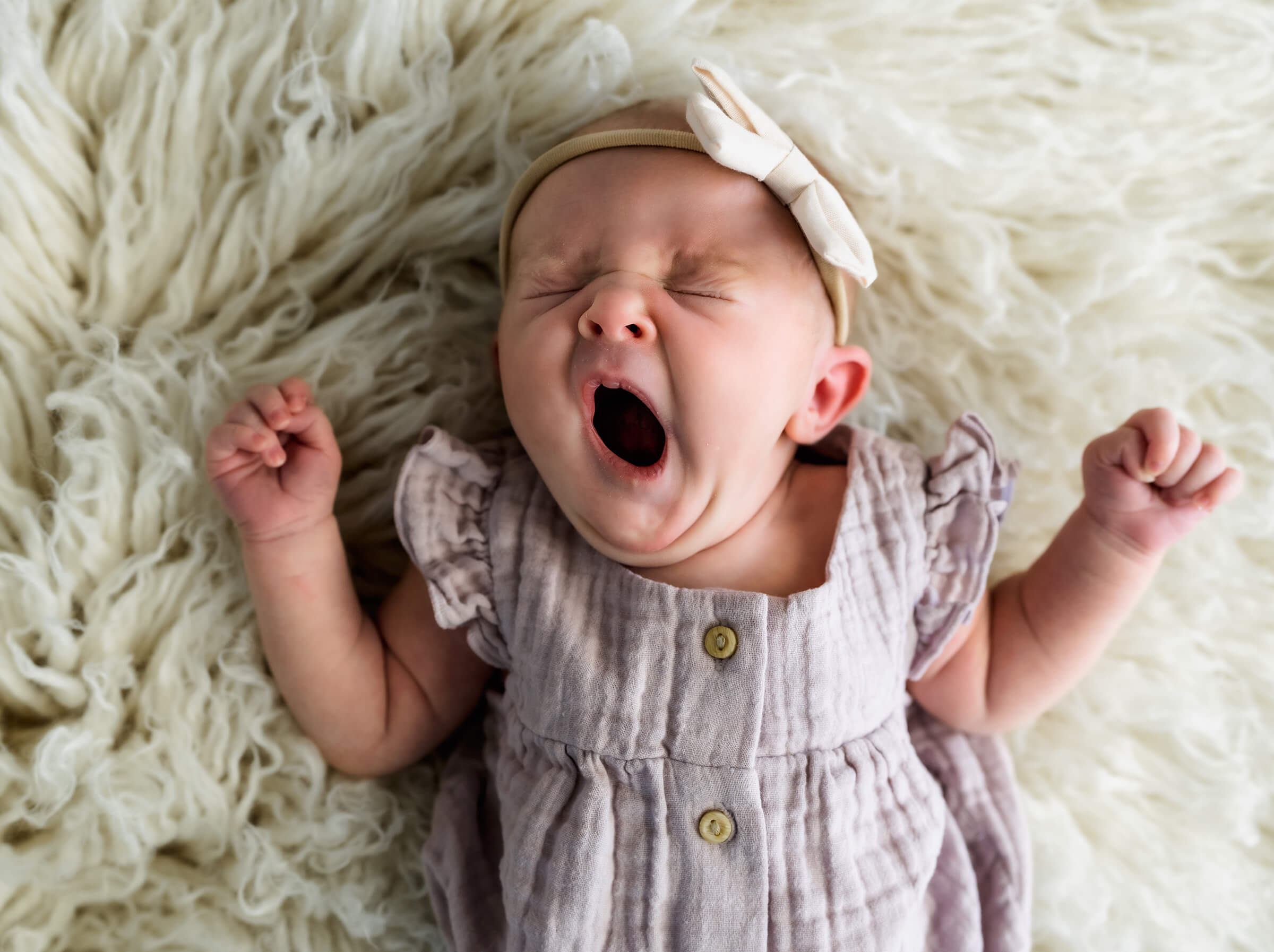 sweet newborn yawn during session