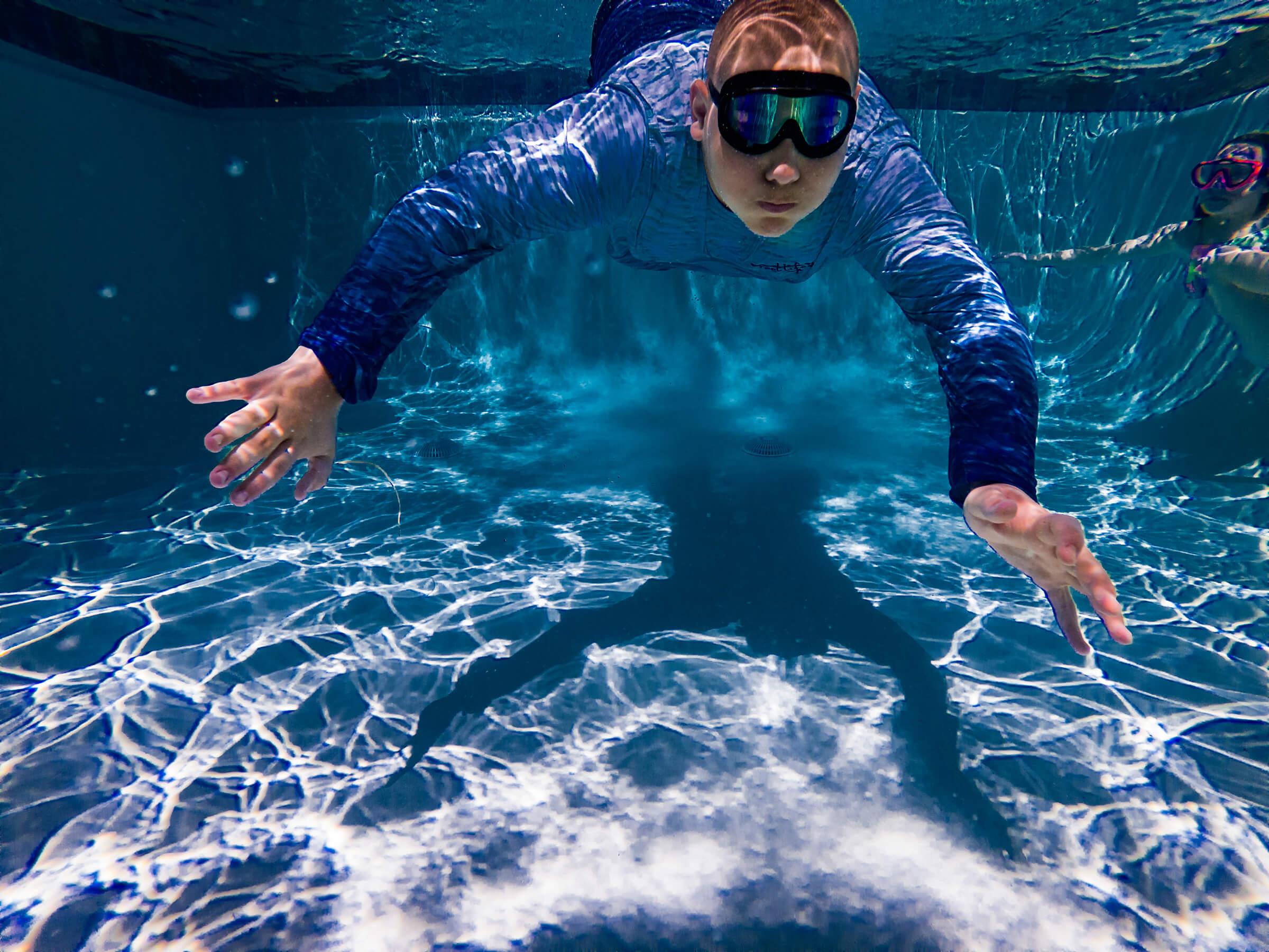 underwater image of boy swimming