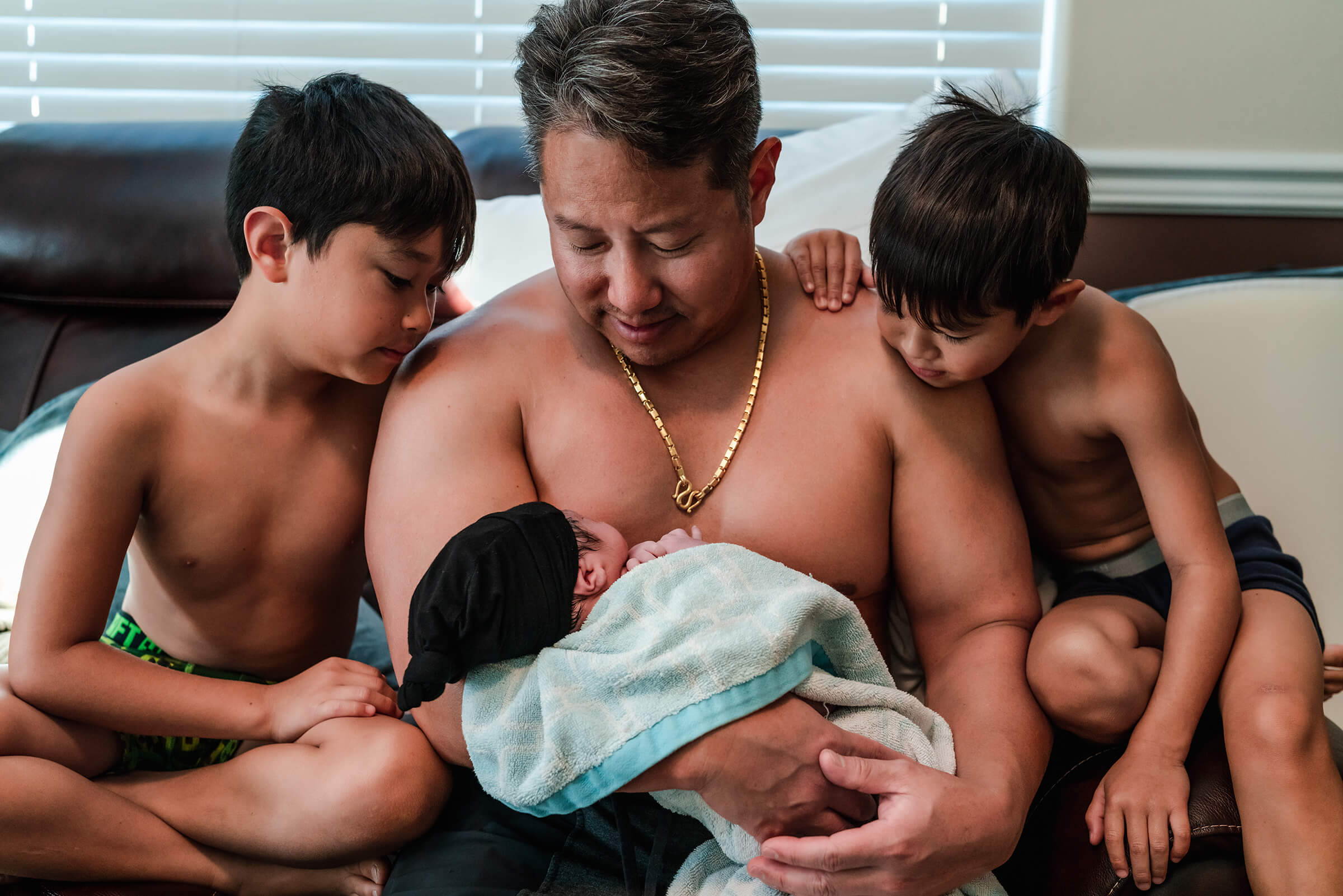 dad with his three sons after a Las Vegas home birth. 