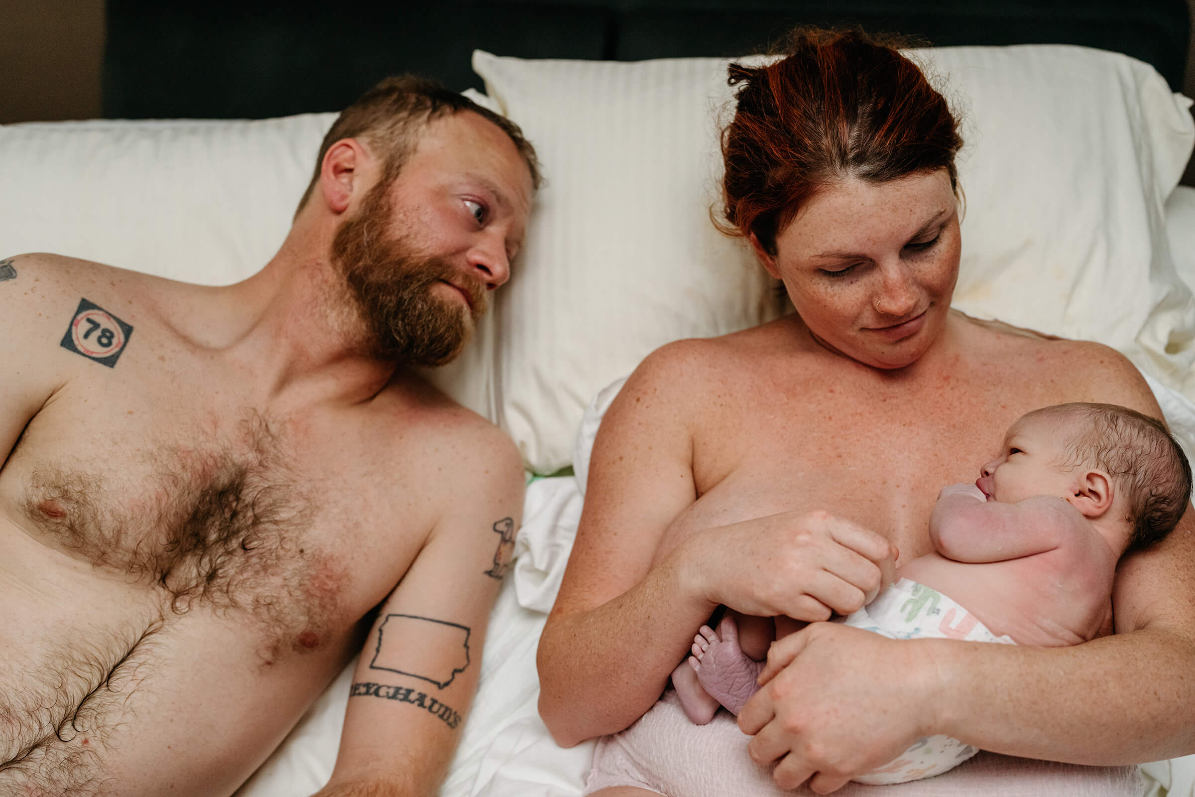 sweet moments between mom, dad, and new baby right after delivery. 