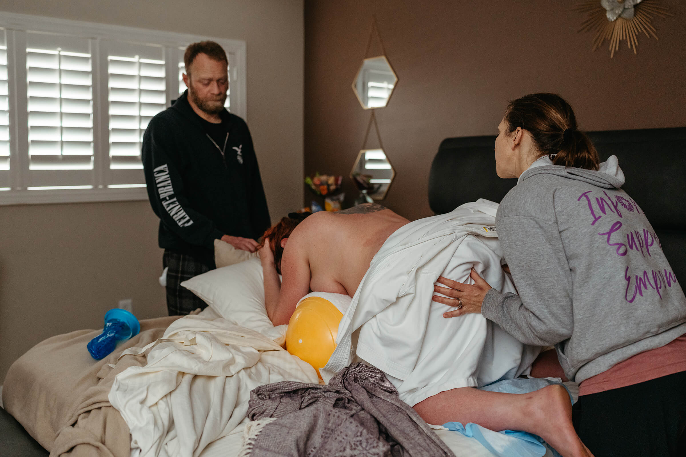 supported mother as she labors on the bed at a Las Vegas birth center