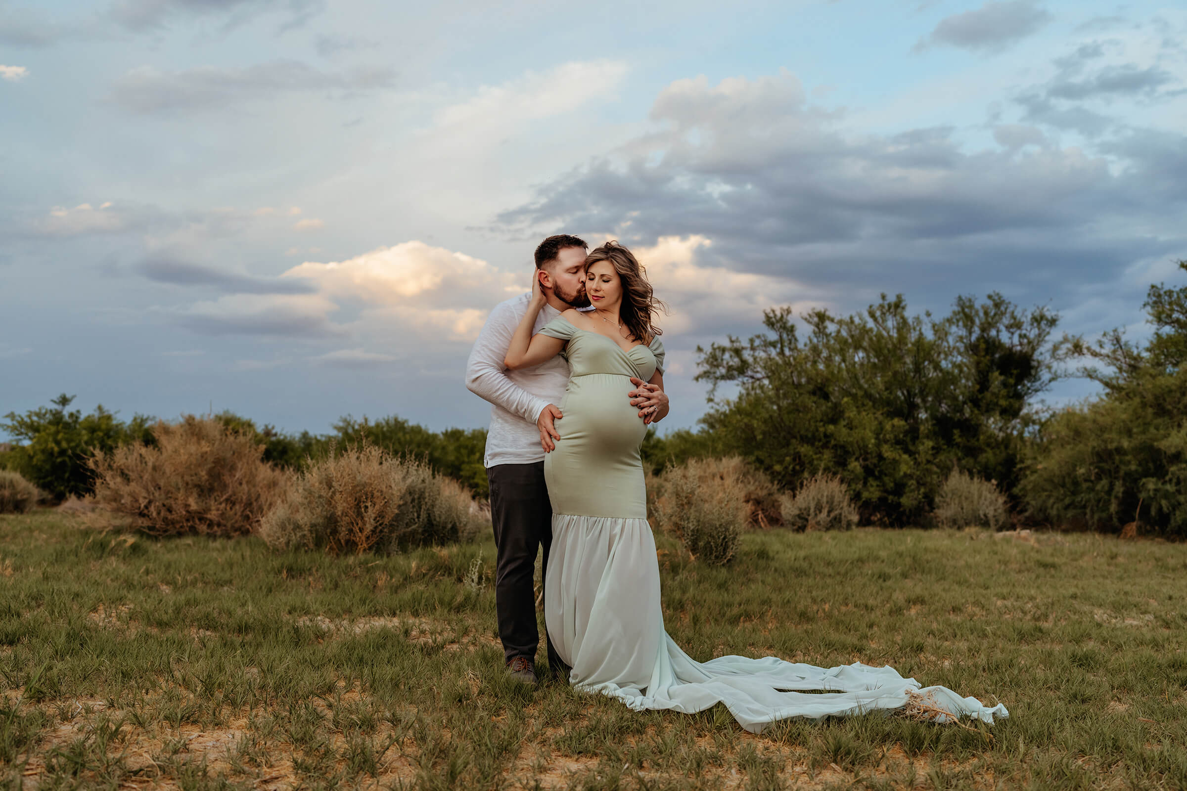 maternity session in the wetlands in Las Vegas with stormy skies