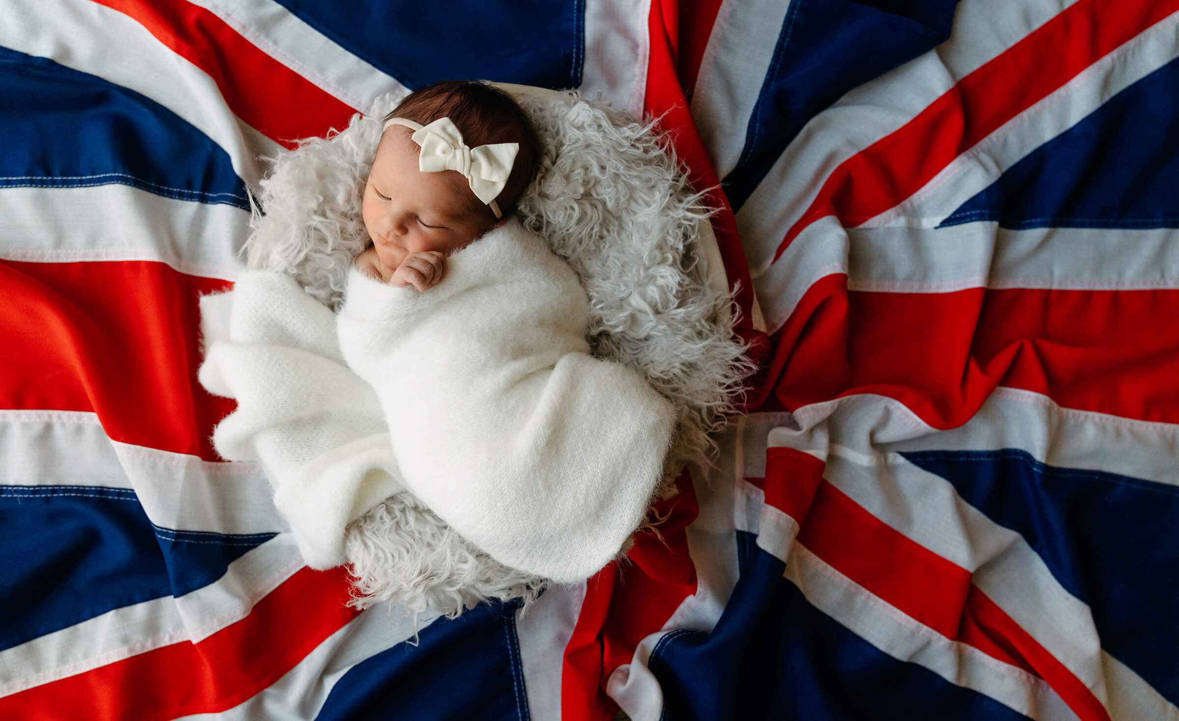 newborn session using Union Jack flag