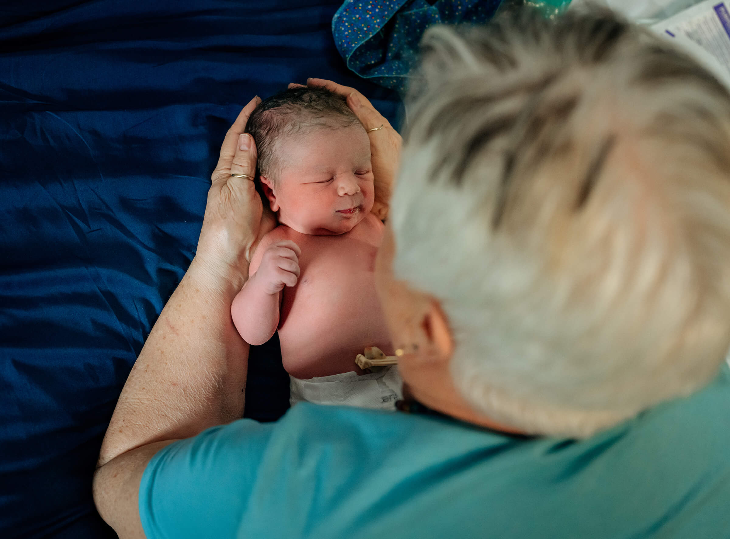 Dixie Story a Las Vegas midwife performing a newborn exam