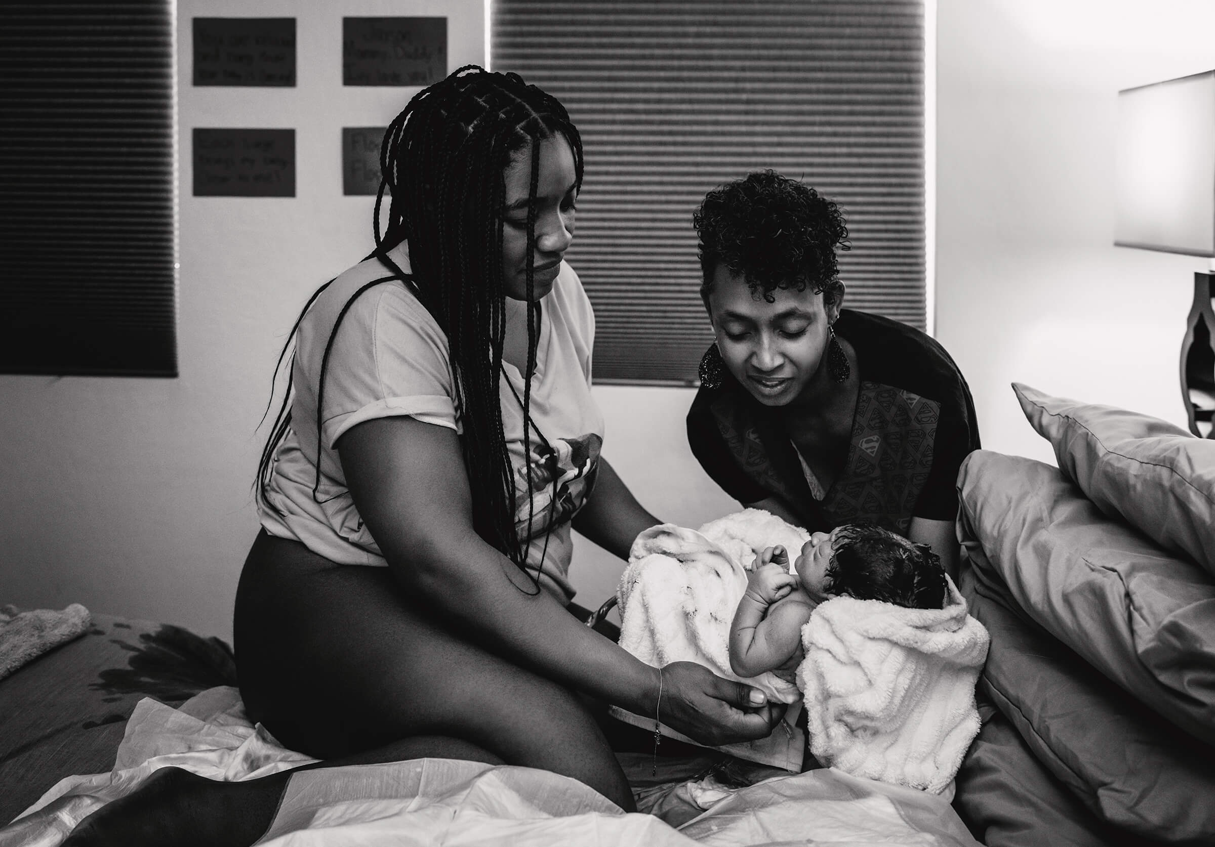 doula holding baby after a fast home birth in Henderson, NV