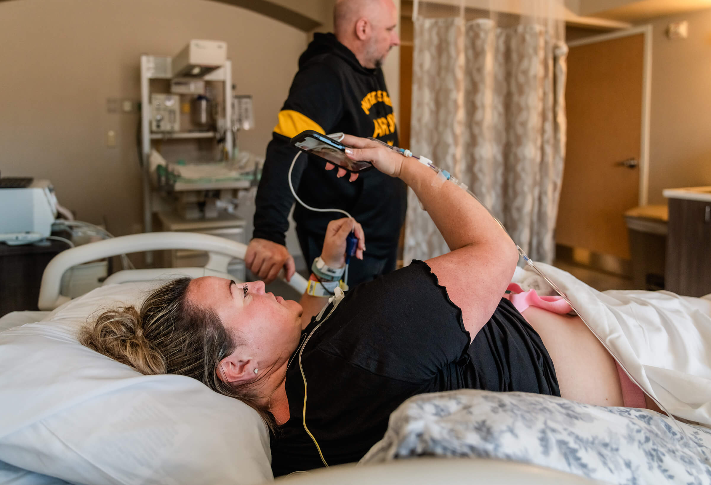 woman on a FaceTime call with her family while on labor and delivery at Southern Hills hospital
