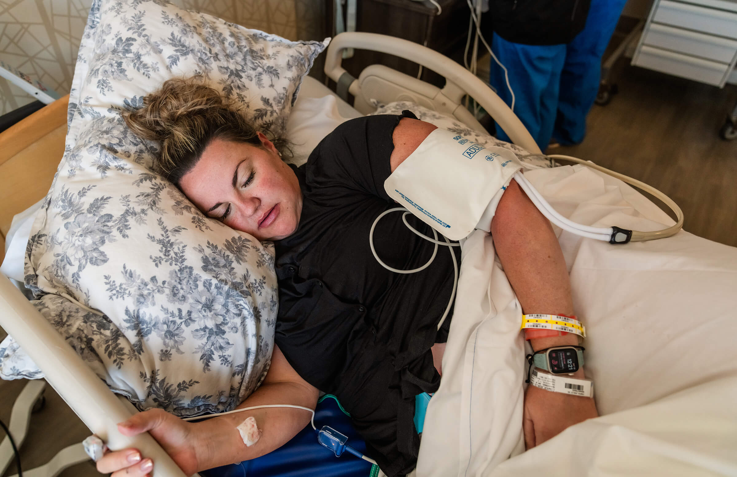 a woman lying in a hospital bed in labor