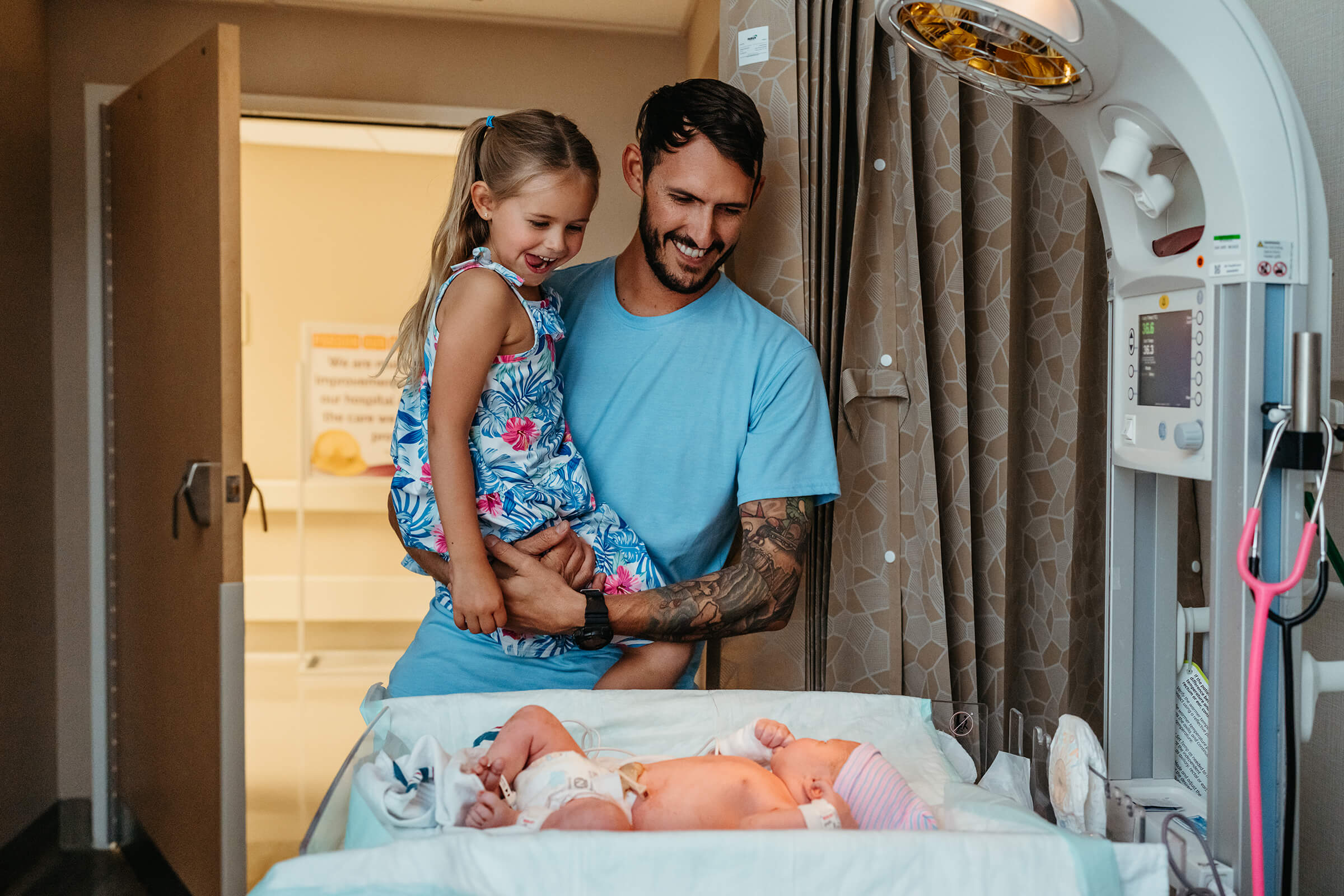 big sister meeting her new baby brother in the hospital for the first time