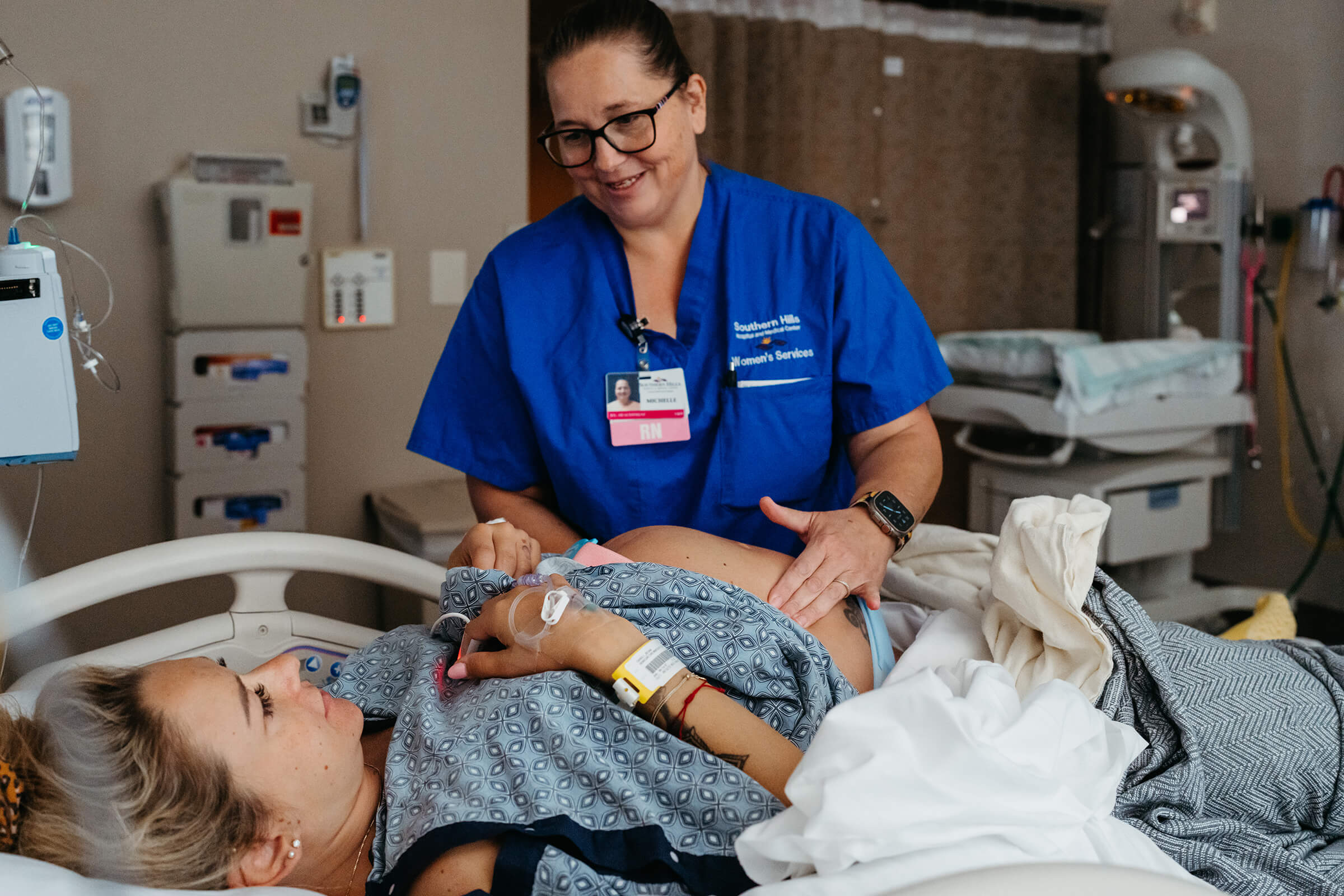 nurse at Southern Hills hospital in Las Vegas palpating her patient's belly for fetal position