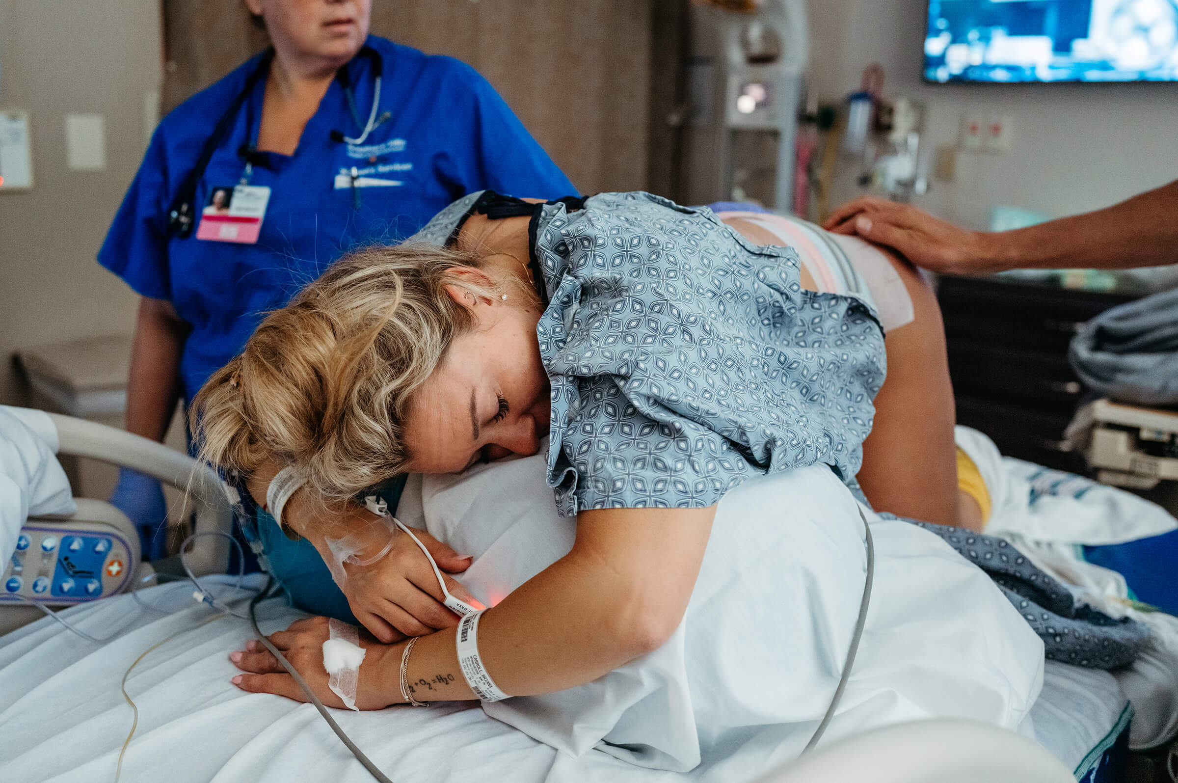 labor nurse at Southern Hills hospital helping position a mother for fetal rotation