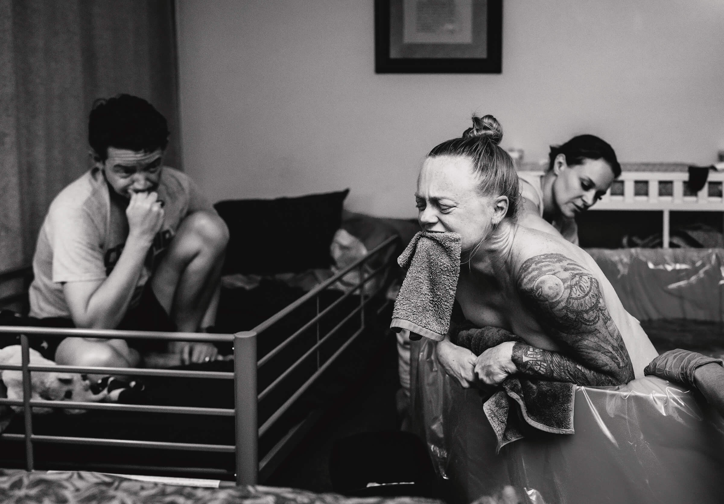 woman biting on a washcloth for pain control while she labors