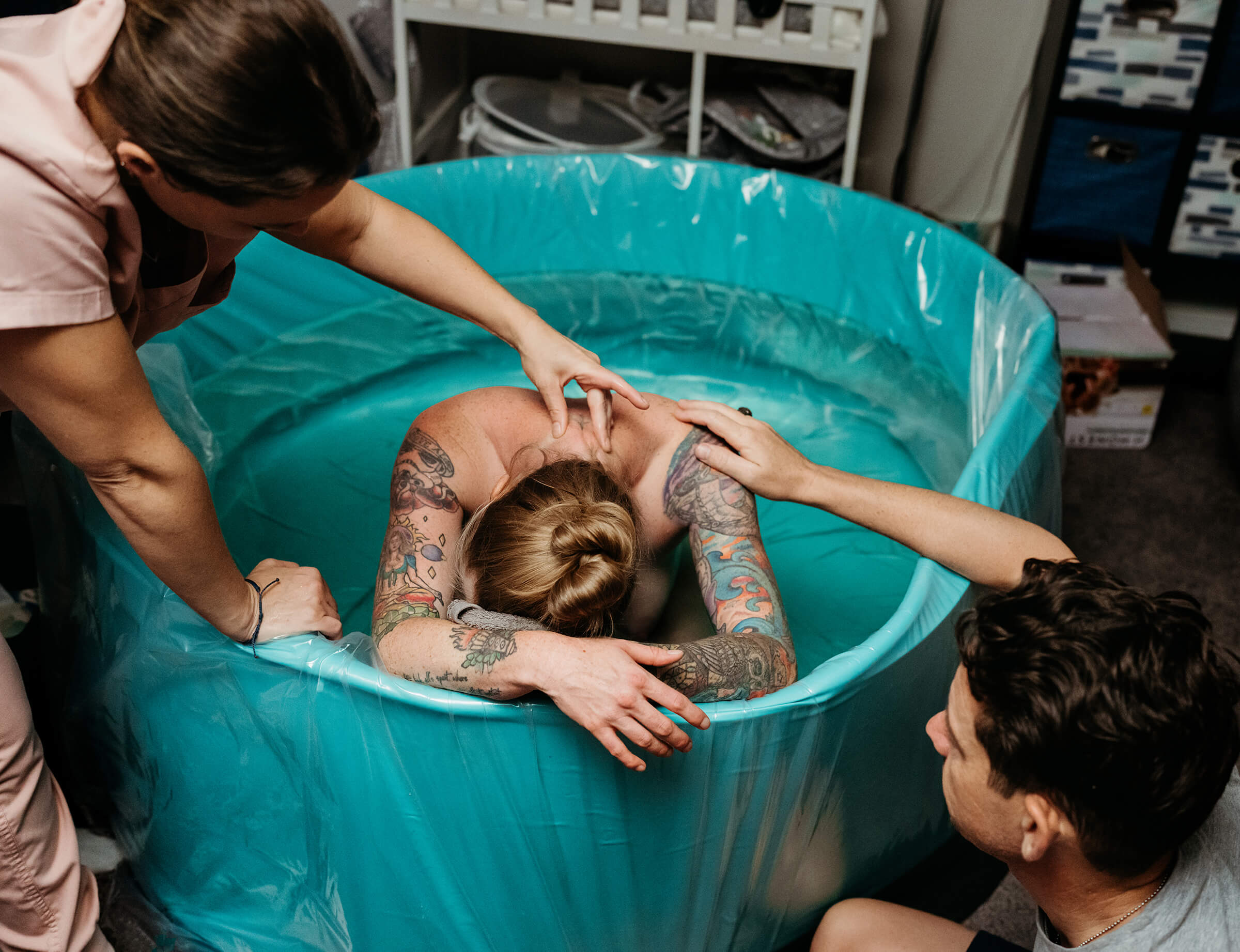 partner and doula providing massage during labor