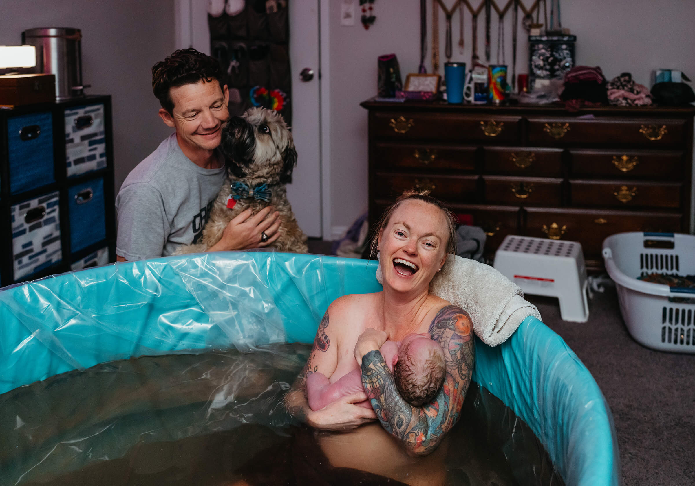 mother rejoicing as husband and dog look on after she has a successful HVAC