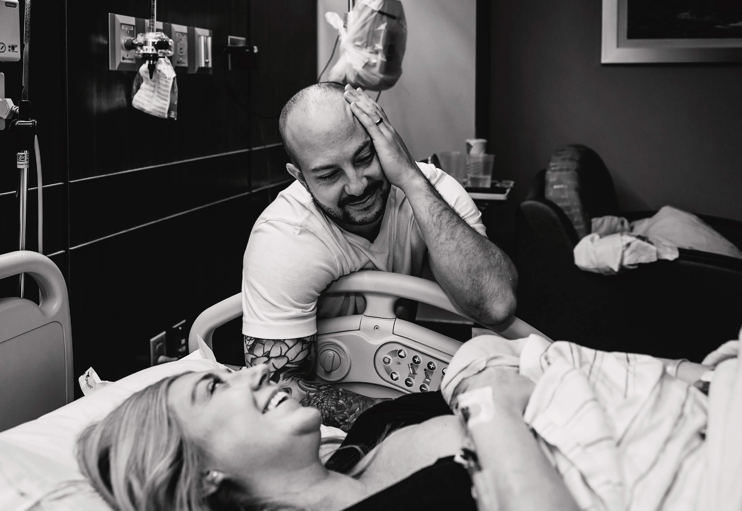 a black and white image of an emotional father following the birth of his daughter at a hospital in Las Vegas