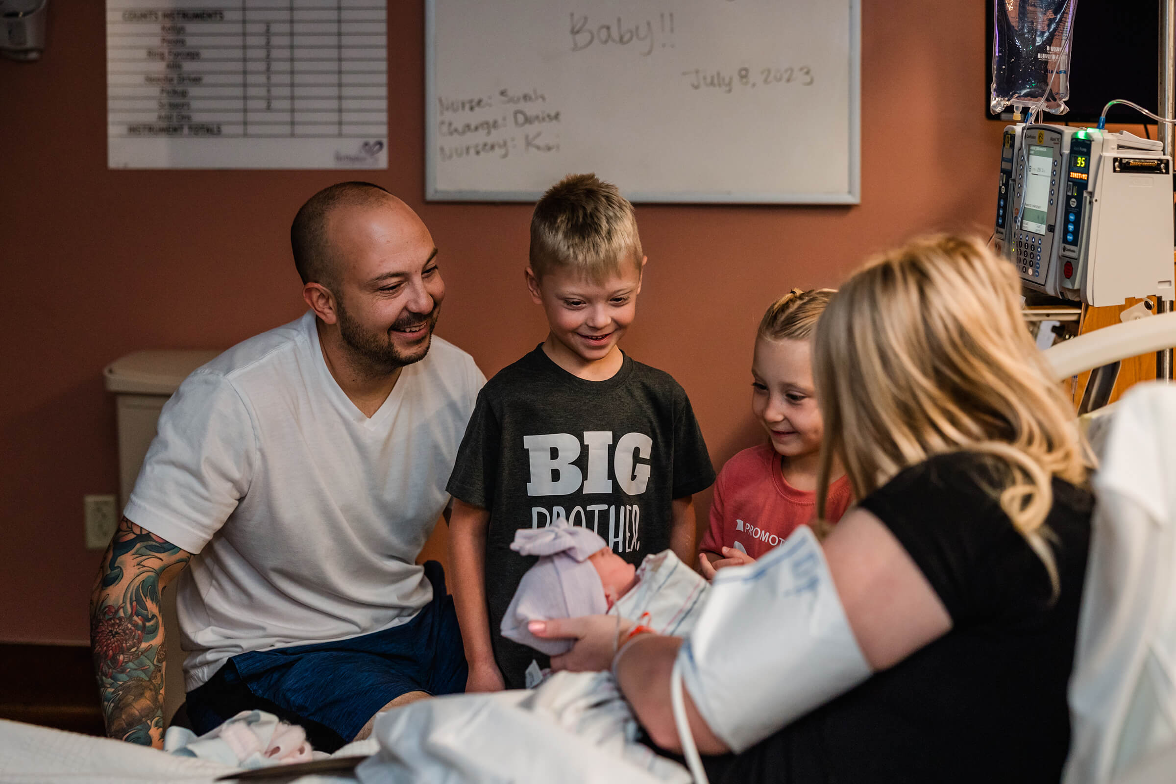 siblings coming to meet their new baby sister right after birth.